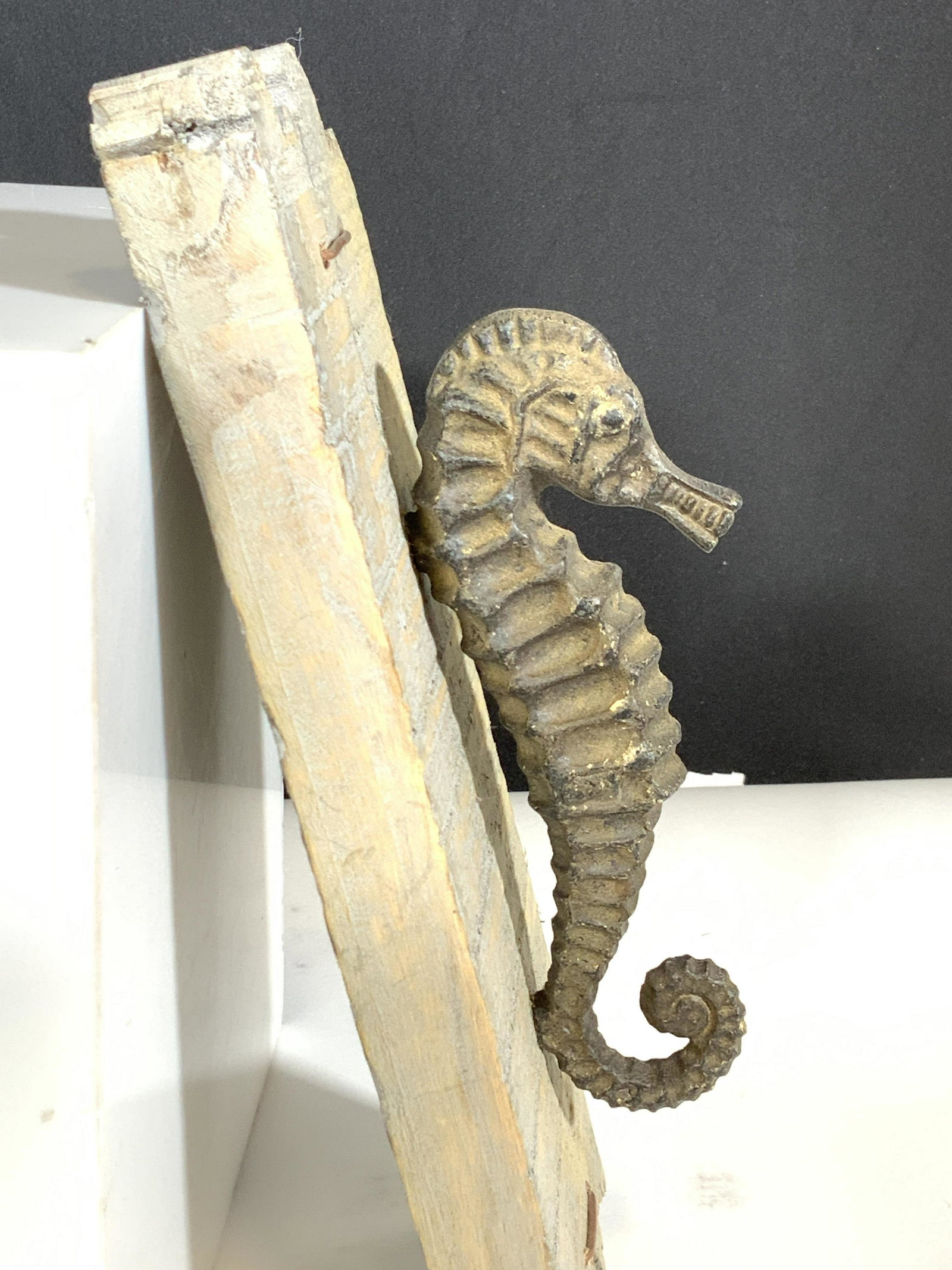 Bronze Seahorse Figural on Wall Board: A perfect addition to a lake house, beach house, 2nd home, or to up lift the atmosphere and change decor. Metal seahorse, possibly bronze, affixed to painted washed borers , grey tone, rustic feel, ba