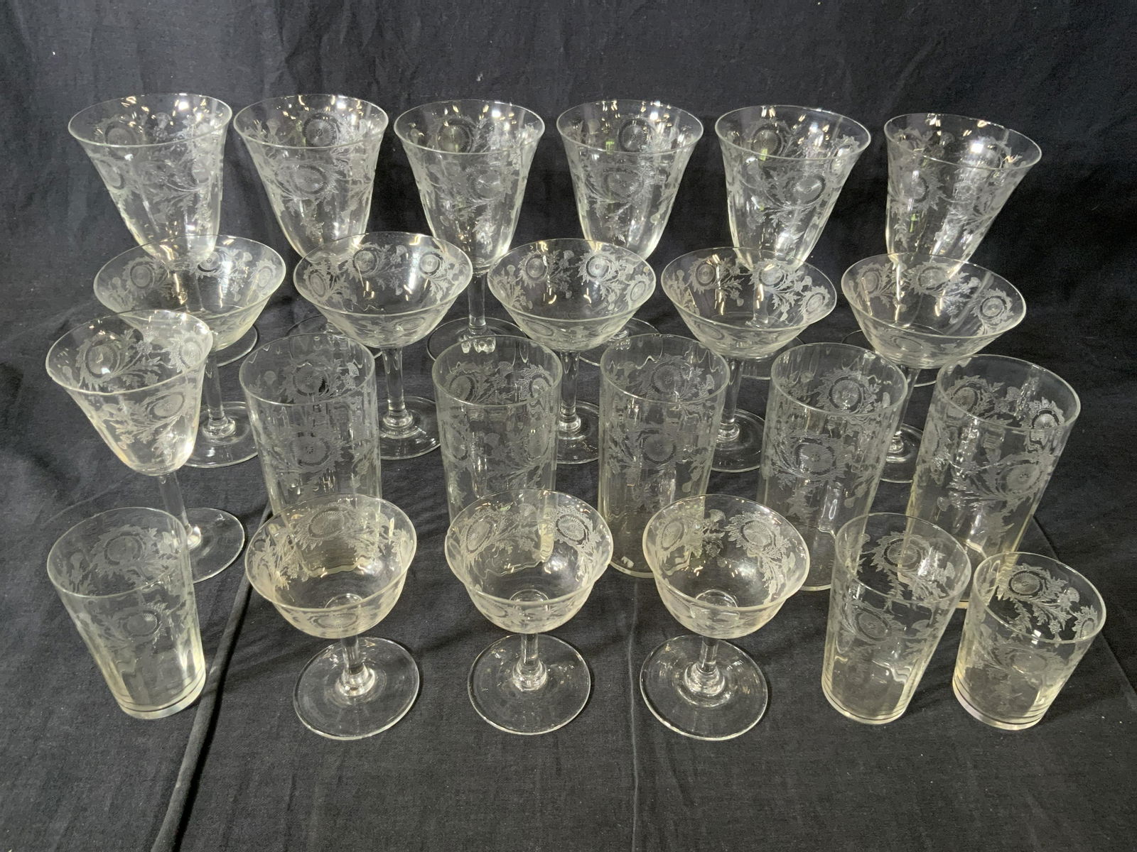 Set 23 Crystal Drinking & Champagne Glasses: Set 23 Crystal Drinking & Champagne Glasses, no apparent inscriptions or marks, smallest glass measures 2 3/4 inches tall x 2 1/8 inches in diameter, largest glass measures 6 1/2 inches tall x 3 3/4 i