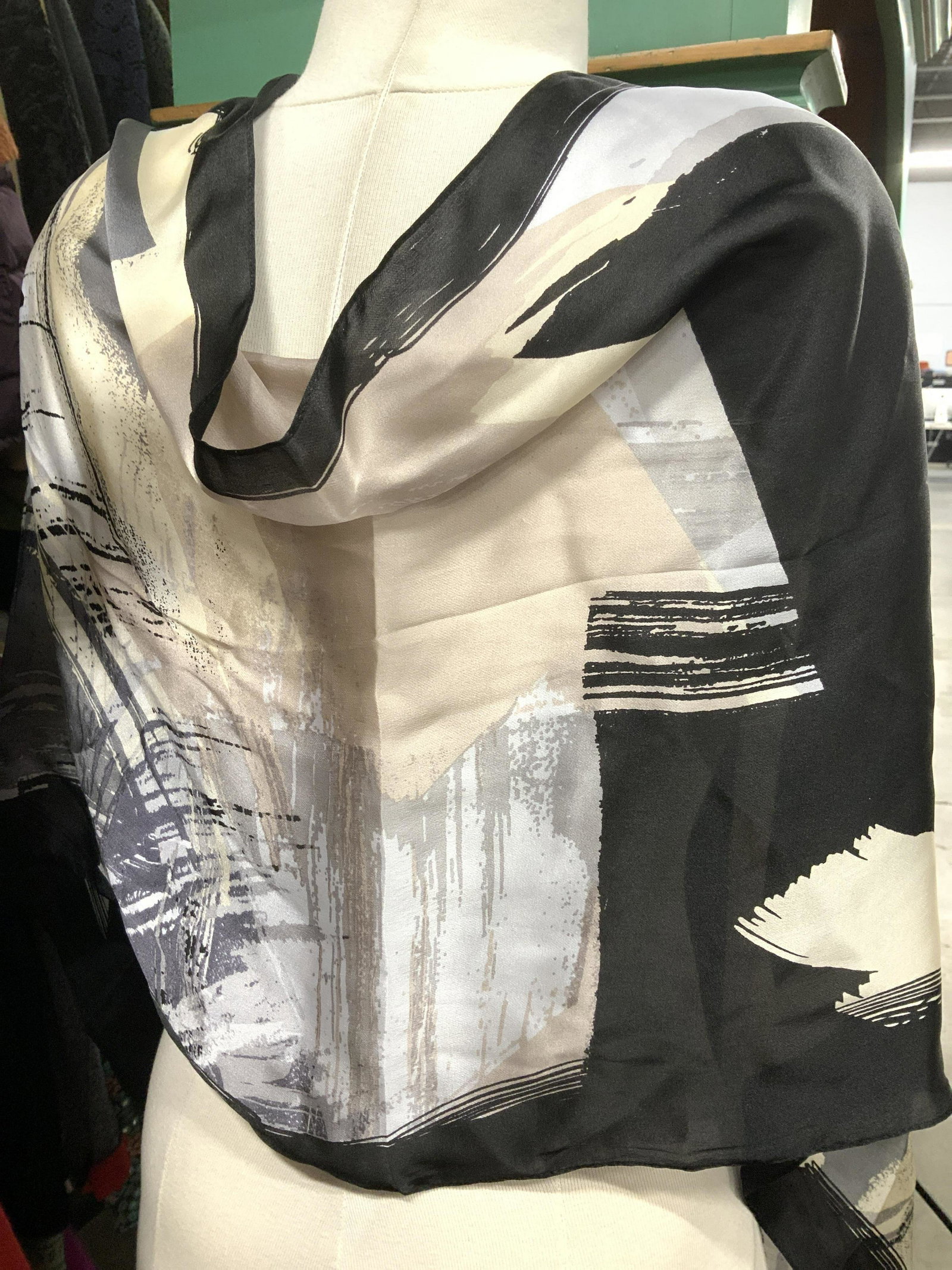 Vince Camuto Signed Silk Abstract Scarf: This scarf is like an abstract painting with muted colors on a black background. Signed Vince Camuto near attached label, reads 100% silk. Long scarf measures 17.25 x 70 in. Ladies Silk Scarf, signed 