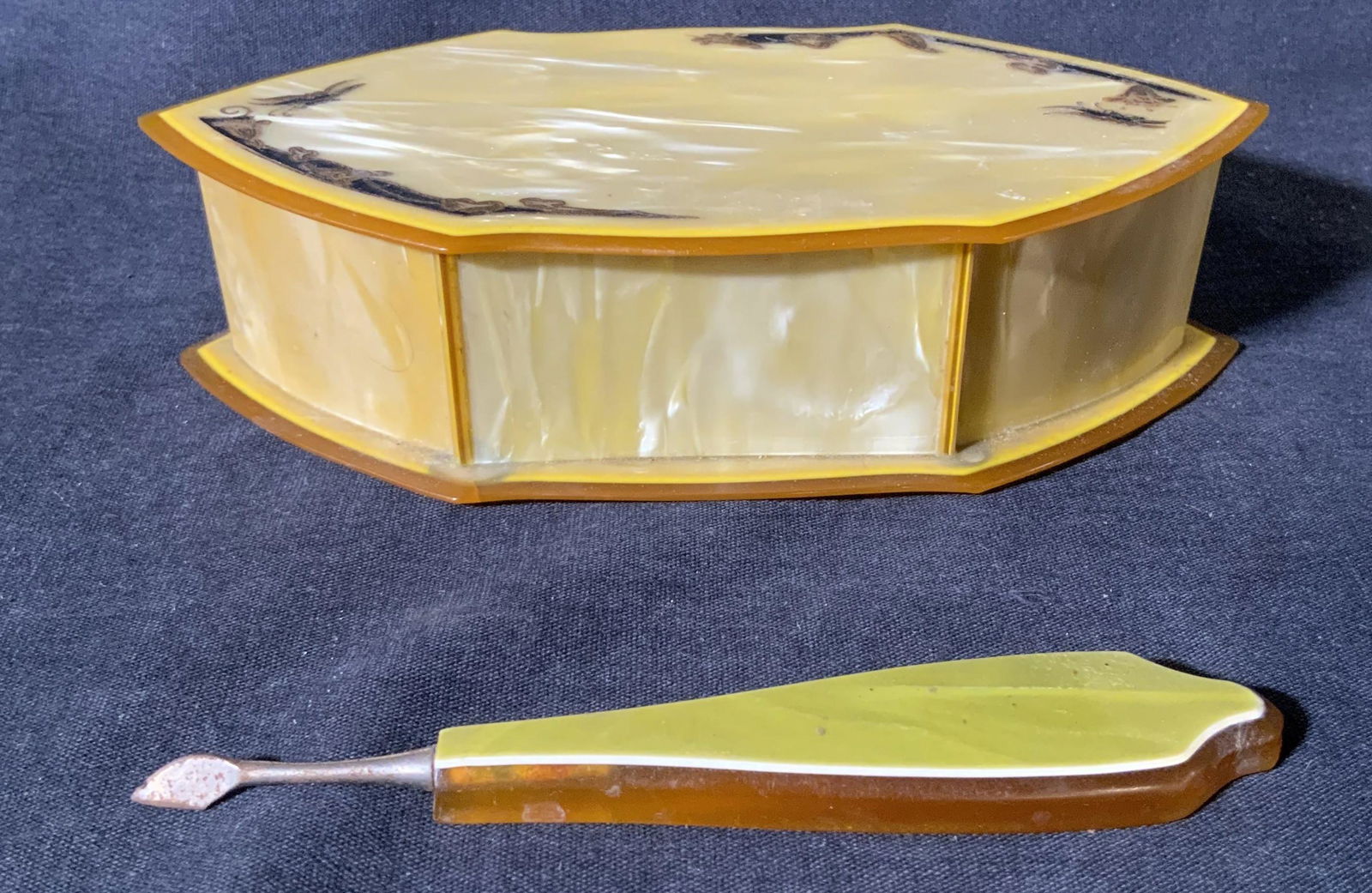 HAMPTON AMERITH Trinket Box & Manicure Tool: Vintage HAMPTON AMERITH Celluloid Trinket Box & Manicure Tool, inscriptions to box reads ‘Hampton Arch Amerith’, no apparent inscriptions or marks to manicure tool, box measures 1 3/4 inches tall