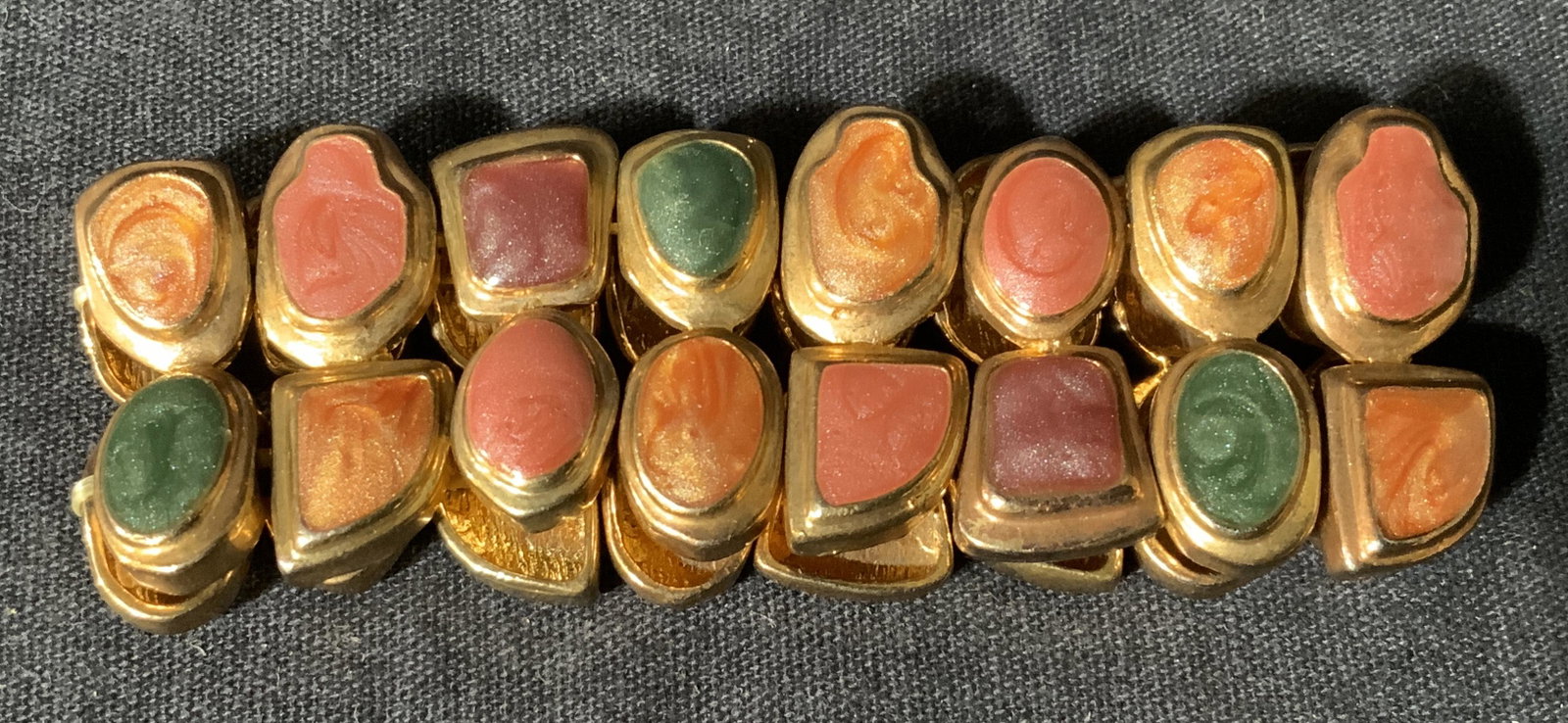 Resin & Metal Bracelet: Resin and metal bracelet, resin and metal beads held together by elastic bands, bracelet is made of a copper colored metal, bracelet laying down flat measures 3.5 inches wide, Resin bracelet, metal br