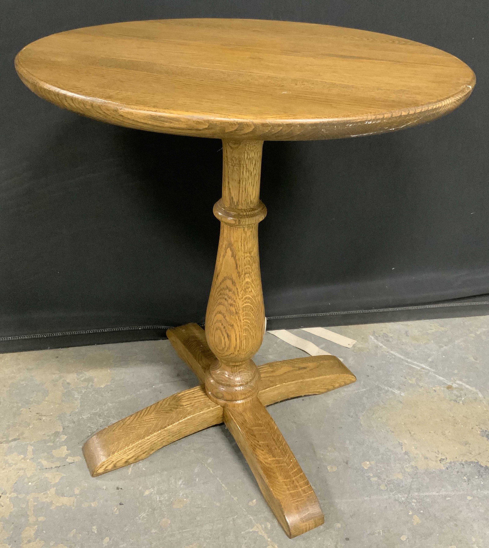 Vintage Wooden Pedestal Table: Vintage wooden pedestal table, rest on x shaped legs. Tabletop is rounded. Wear is consistent with age and use. Measures approx 20 inches h and 17 inches in diameter. Tea table, occasional table, side