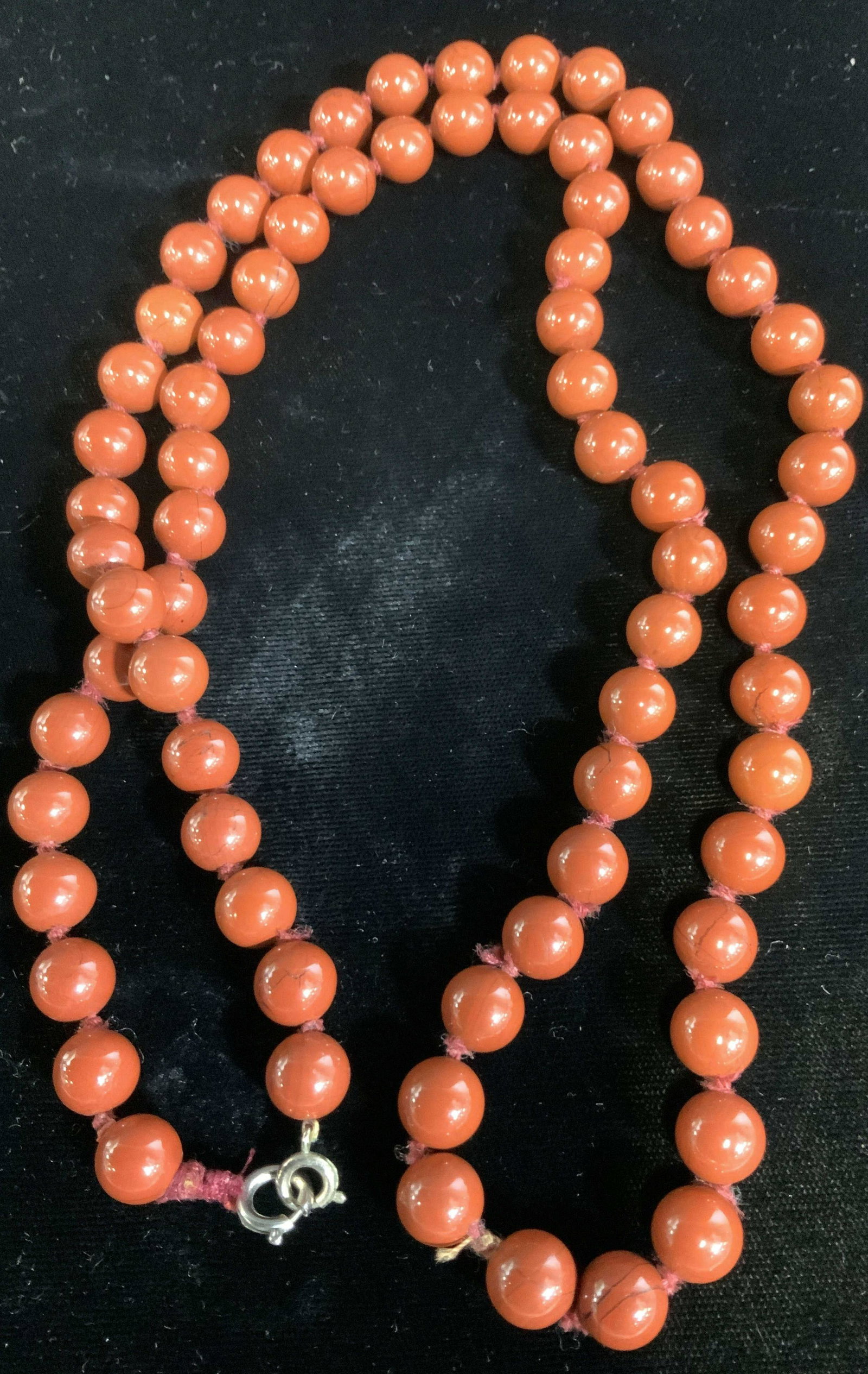 Lot 6 Mixed Fashion Jewelry/ Accessories: Single strand of glass beads with c spring clasp, double knotted, 30 in. Gold tone Nugget and bead choker necklace, signed Jaded, 15 in. Etched butterfly brooch, signed Made In Italy. Love Knot goldto