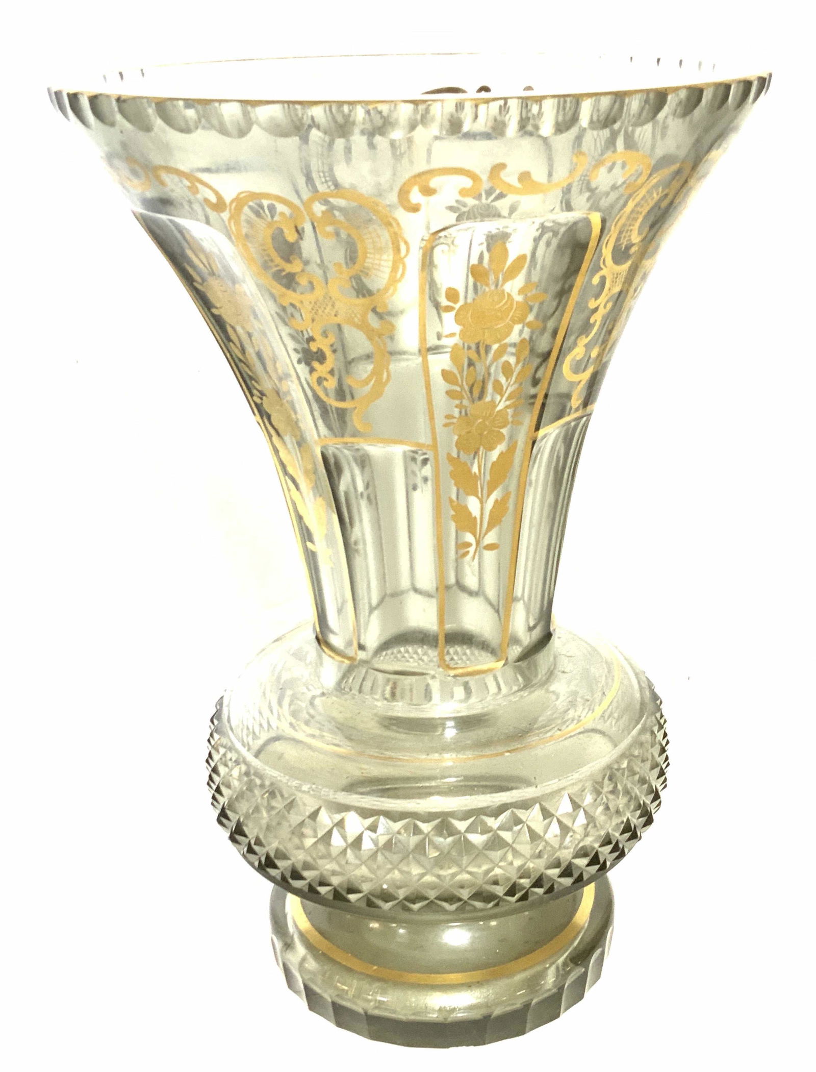 Centerpiece Vintage Cut Glass Victorian Vase: Smokey Grey clear glass with hand painted gilt scrolls and florals. Flat gilt rim , opens wide then narrows toward body of vase. embossed cut triangular pattern evens out the symmetry. 12 in ht., 8 in