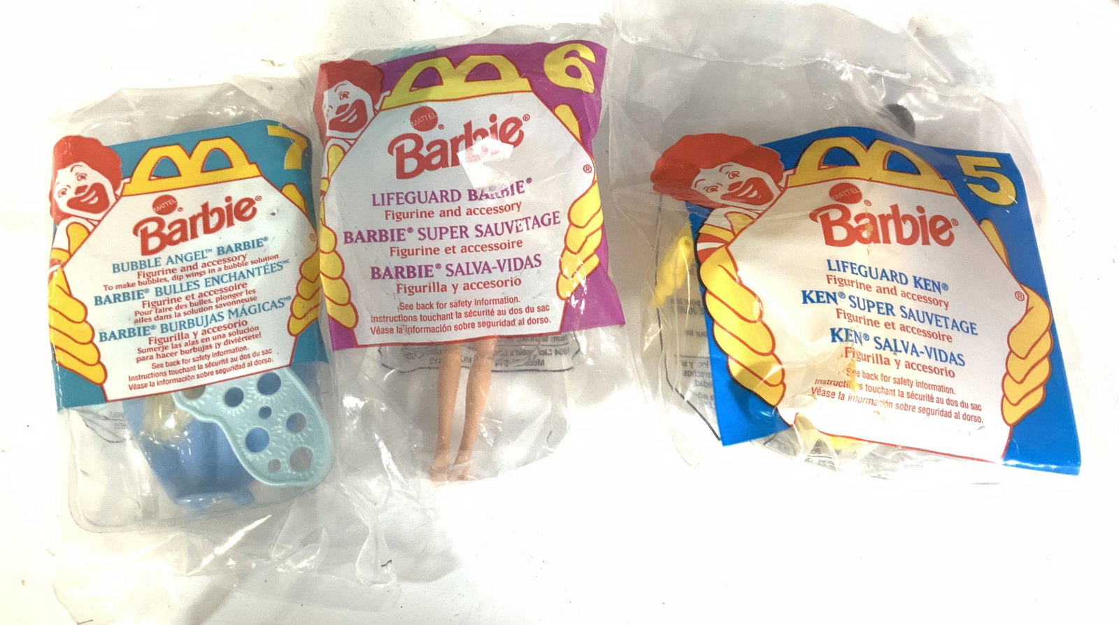 Lot3 Mc Donalds Miniature Barbies Org Package 1994: Lifeguard Ken Figurine, Lifeguard Barbie Figurine, Bubble Angel Barbie- makes bubbles when you dip her wings in a bubble solution. All in original Mc Donaldons Package. Vintage 1994. Barbie Figurines,