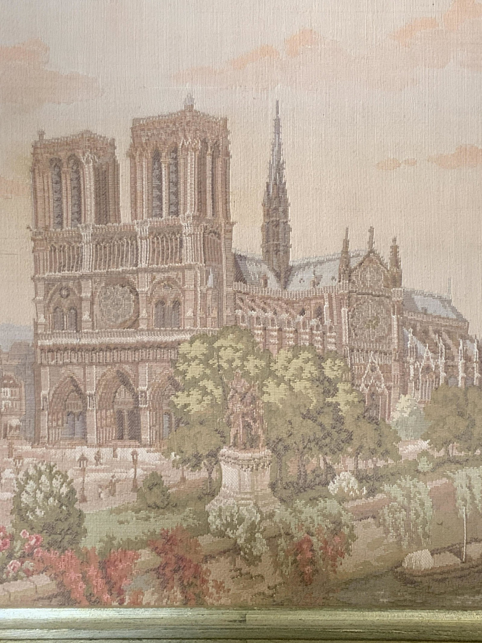 Framed Needlepoint of The Cathedral of Reims: Framed Needlepoint of The Cathedral of Reims, no apparent inscriptions or markings, subject needlepoint version of the Cathedral of Reims in France, metallic painted wood frame, measures as a 15.5 inc
