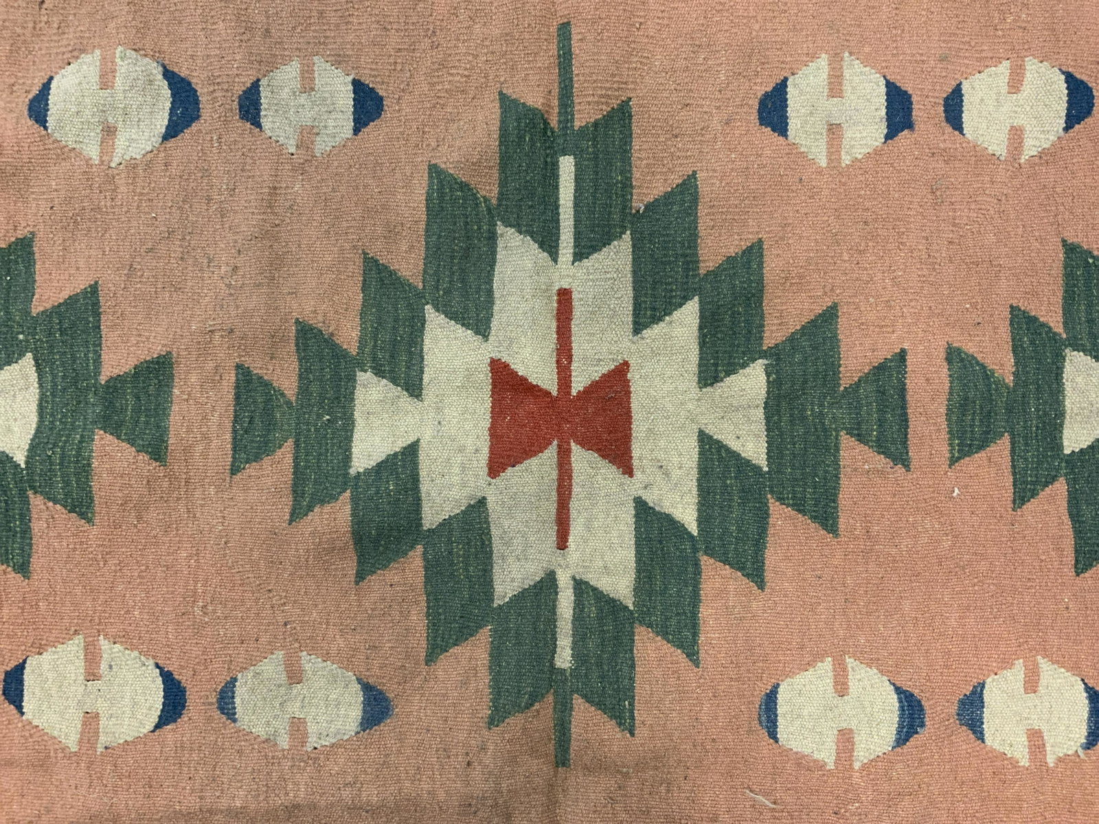 Vintage Wool Fringed Area Rug: Vintage wool area rug, southwestern motif, multi toned geometric shapes and patterns. Ends are fringed, hand knotted. Wear is consistent with age and use. Measures approx 75 inches long, 44.5 inches w