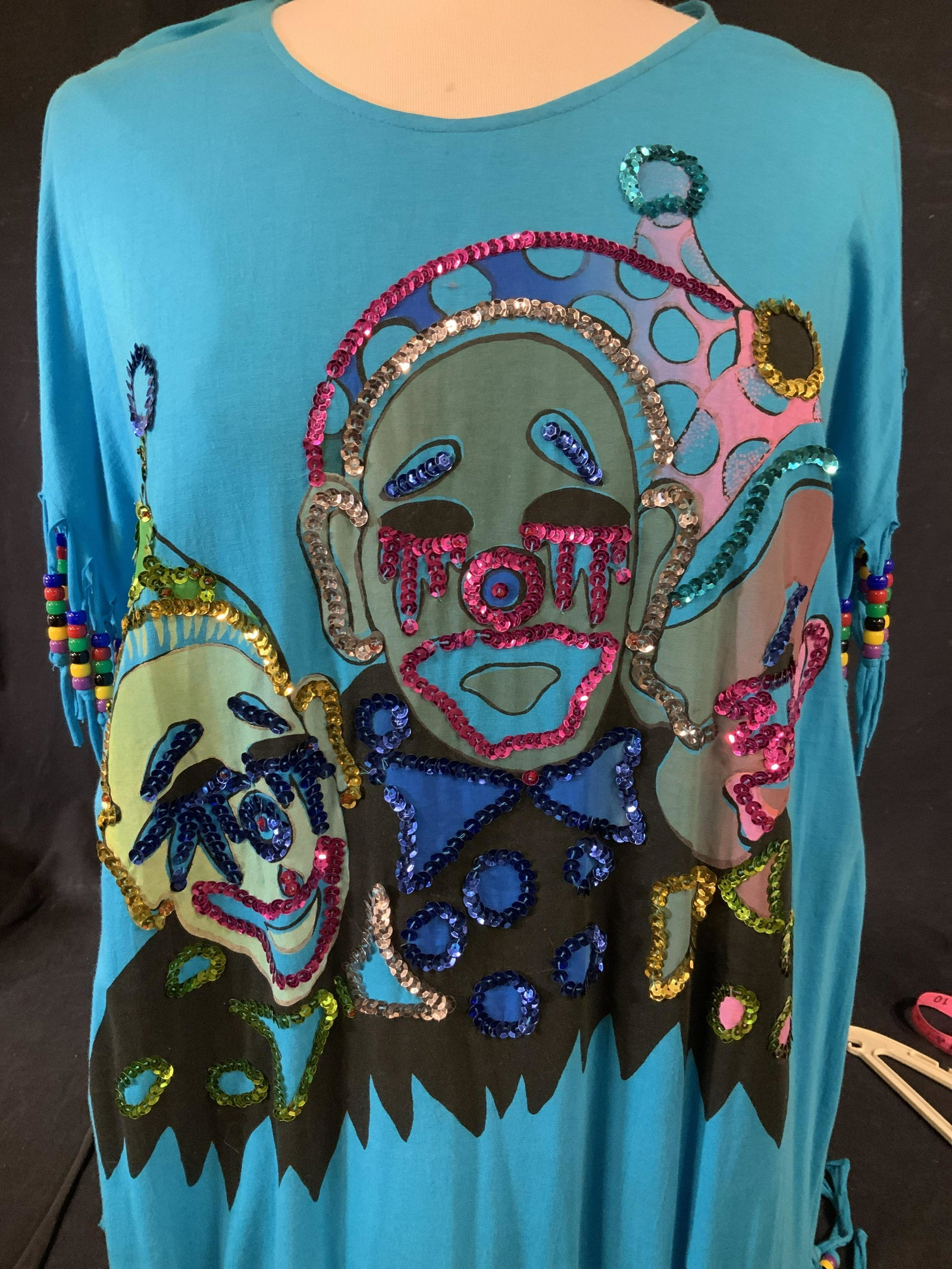 ALPHA I Blue Cotton Ladies Wearable W Sequins: A multi purpose Ladies garment, depending on how you see it worn. Could be a long tee shirt, a swimsuit cover up, beachwear, short dress, Evening wear at a club, more. Aqua Blue Cotton, crew neck, bea