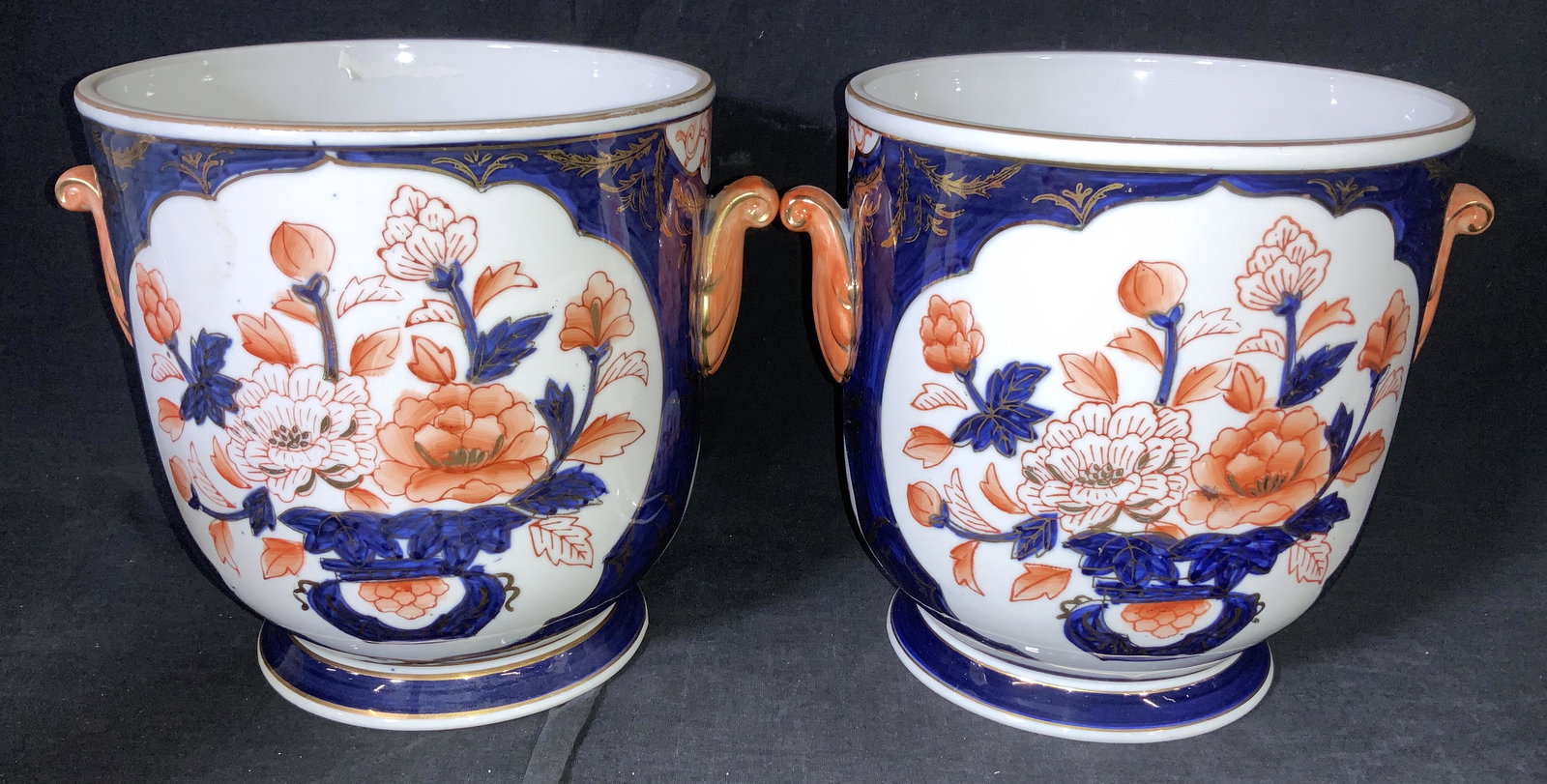 Pair Lord & Taylor Porcelain Amari Planters, Japan: Hand painted Blue and orange with outlined gilt Imari Planters, expressly made for Lord & Taylor, a luxury department store that just signed off as one of the economic COVID fallouts. This pair expres
