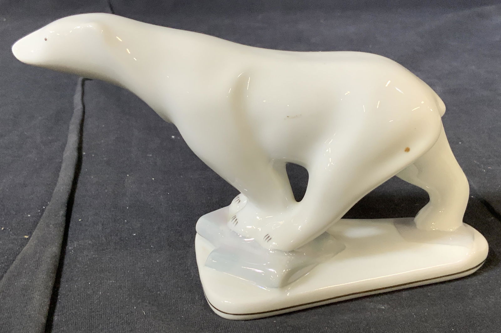 Porcelain Polar Bear Figural, Romania: Majestic Polar Bear Porcelain figural standing on glacial ice base. Hallmarked In green ink under glaze- Made in Romania, possibly marked JRTS CLUB , illegible. Hand crafted vintage figural , 7 in lon