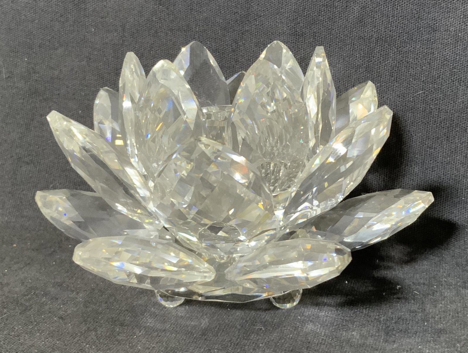 SWAROVSKI Lotus Flower Crystal Candleholder: SWAROVSKI Lotus Flower Crystal Candleholder, inscription to base reads ‘Swarovski’, measures 2 1/2 inches tall x 3 7/8 inches in diameter, surface wear and minor chips to piece, Swarovski, flowers