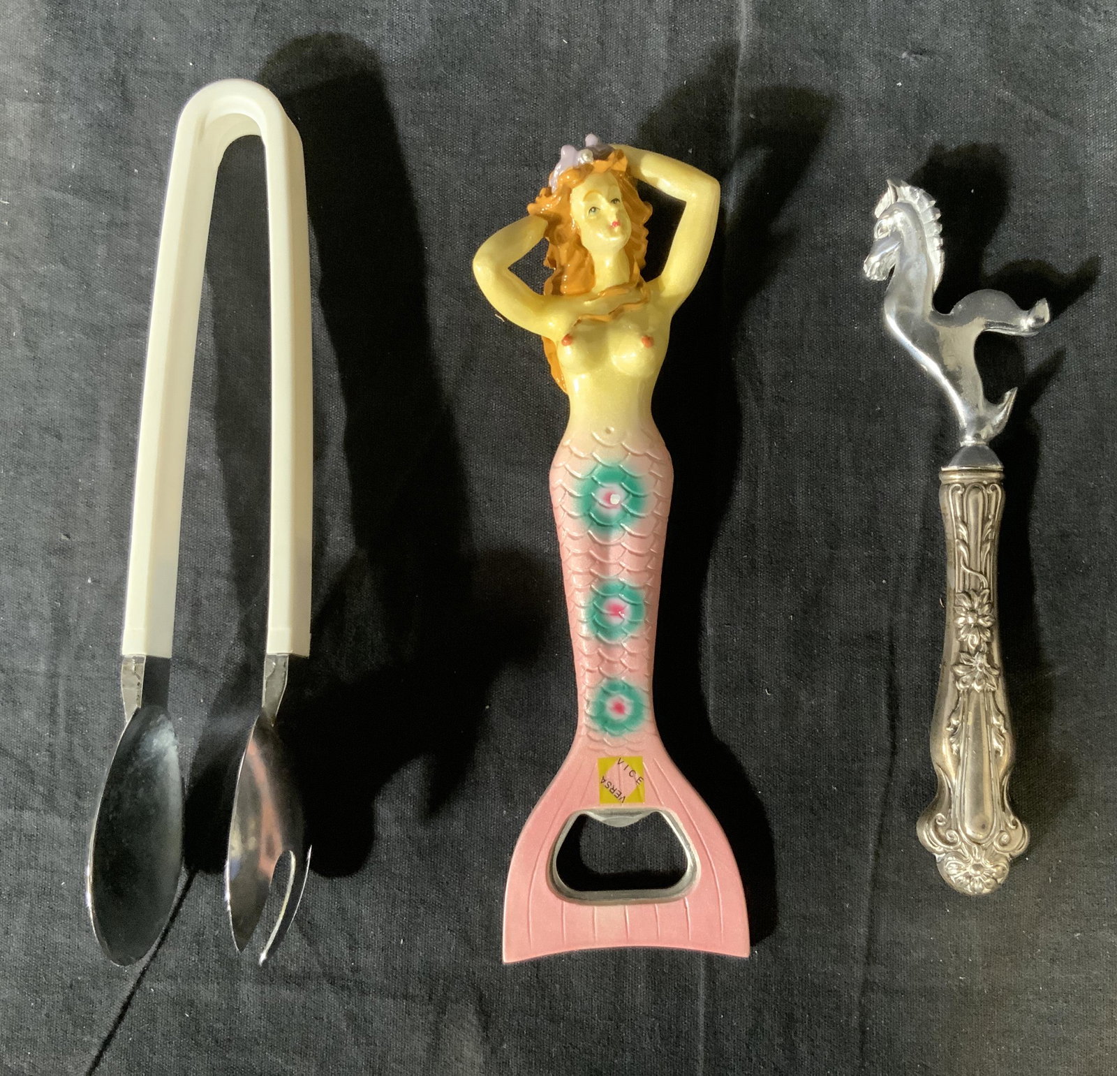 Lot of 3 Bottle Openers and Tongs: Lot of 3 Bottle Openers and Tongs, one bottle opener is Sterling handled, inscriptions read ‘vice verse’, inscription to handle of horse bottle opener reads ‘Sterling’, smallest piece measures