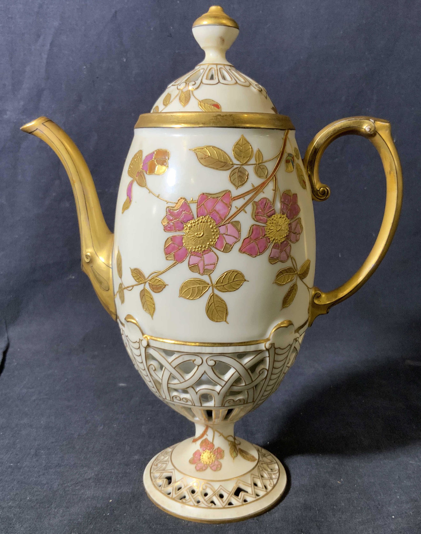 Vintage F & M Pierced Porcelain Teapot: Vintage F & M Pierced Porcelain Teapot, inscription to base reads ‘F & M’, pierced base and lid with gilt floral design, measures 9 5/8 inches tall x 7 inches wide, surface wear to piece, Vintage,