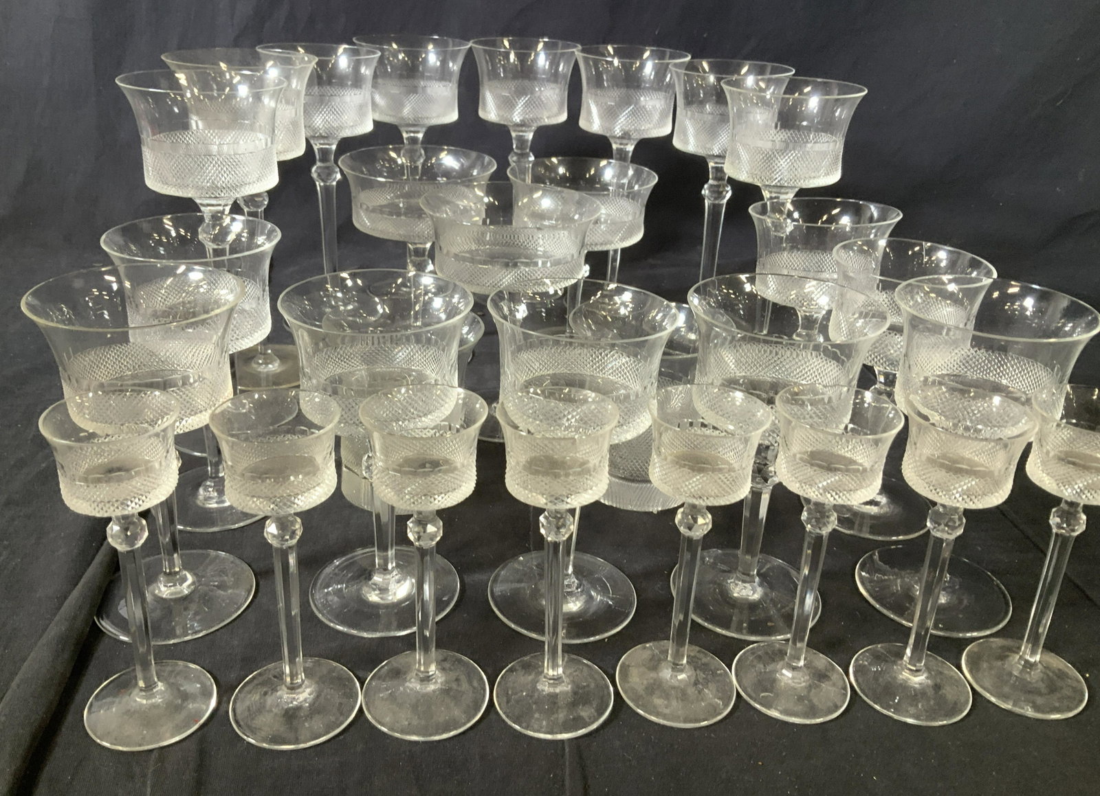 Vintage Set 29 Cut Glass Stemware: Mid century Glassware Set for Champagne, Wine, Cordial Liquor, Scotch, more. 8 tall wine glasses, 2 with glass crack/ rim issues. Measure 7.5 in. Ht 3 Mid century Champagne glasses, 4 in. Wide, 5.25 i