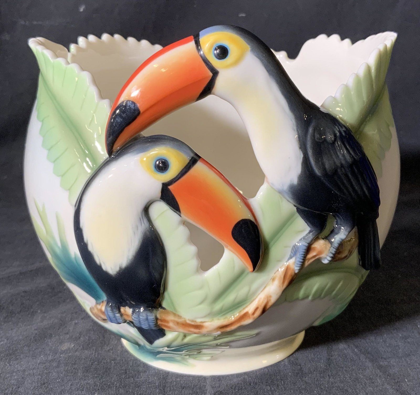 FRANZ Porcelain Candle Holder: FRANZ Porcelain Candle Holder, comes in original box, inscriptions read ‘FRANZ Paradise Calls Toucan Design Sculptured Porcelain Candle Holder’, measures 5 1/2 inches tall x 6 1/8 inches in diamet