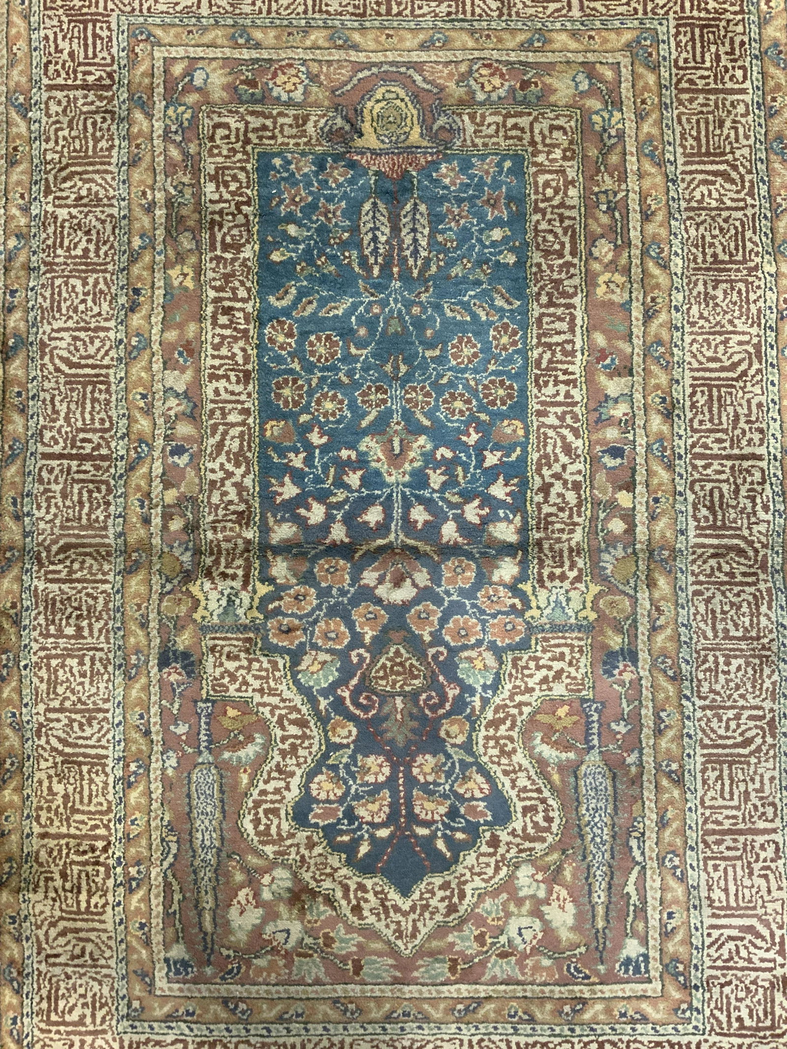 Antique Turkish Handmade Wool Area Rug: Rug is handmade and wool. Piece appears to be Turkish and possibly antique. Rug contains intricate multi toned floral, vine, leaf & geometric detail. Piece has fringed edges. Rug measures approx 58 in