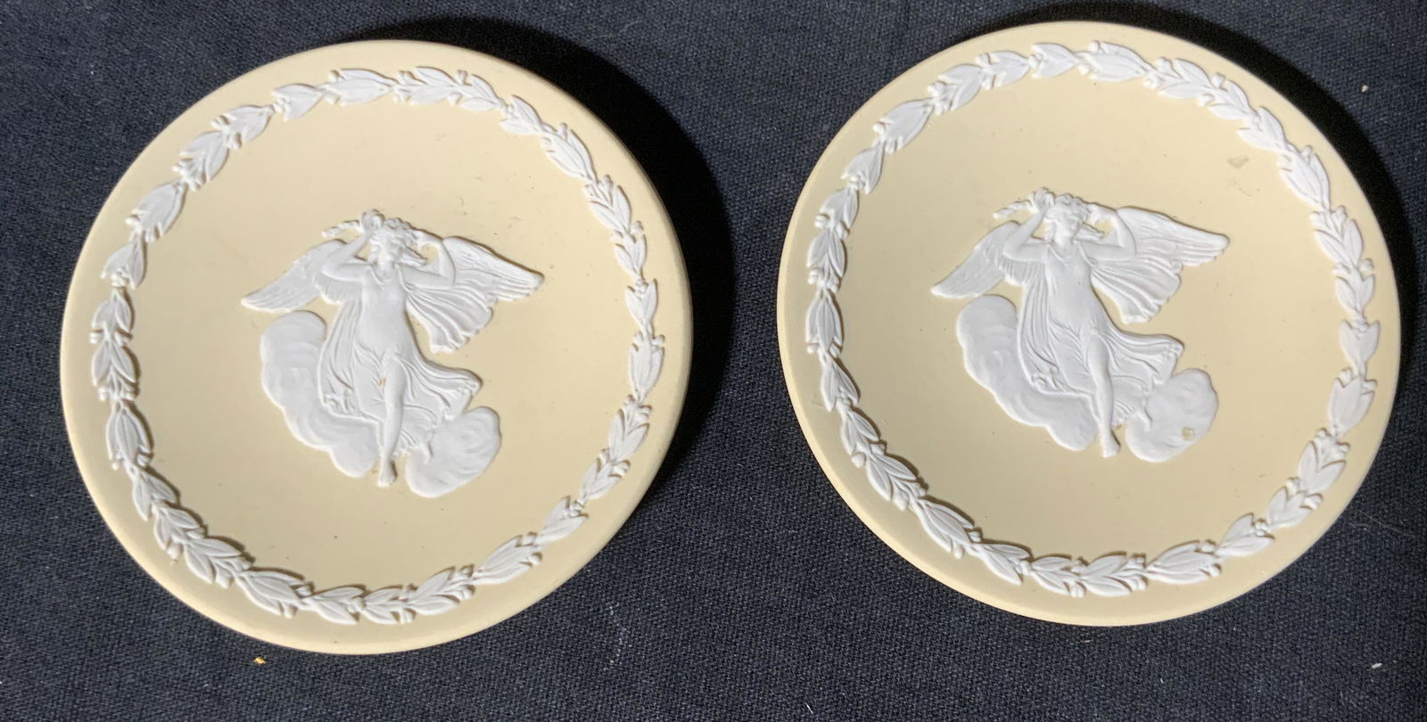 Pair WEDGWOOD Jasper Ware Butter Pats: Pair WEDGWOOD Jasperware Butter Pats, inscriptions read ‘Wedgwood Made in England’, dishes feature angels and laurels, both measure 3 inches in diameter, surface wear to dishes, Wedgwood, Jasperwa