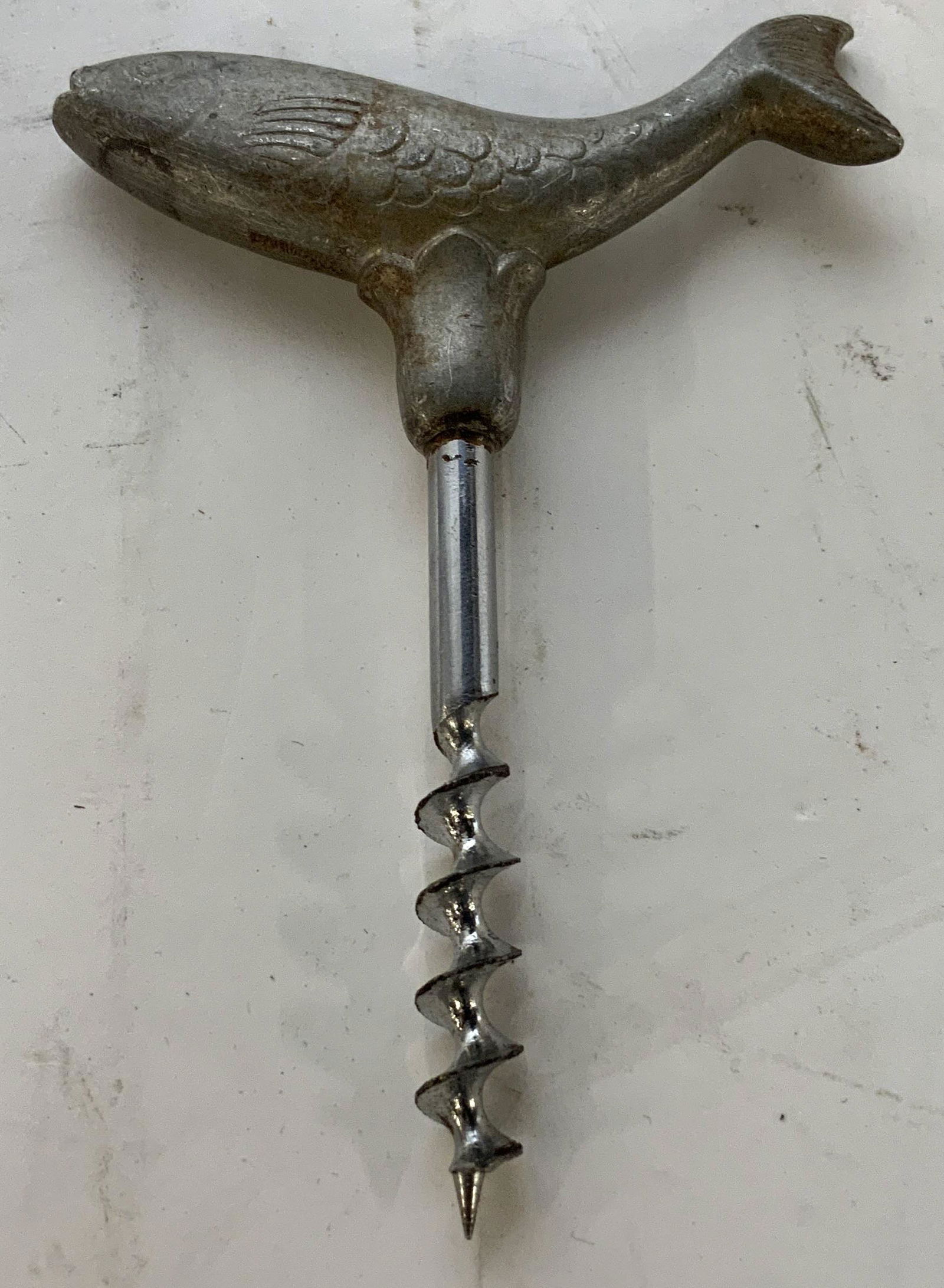 JUST ANDERSEN Vintage Metal Fish Wine Opener: JUST ANDERSEN Vintage Metal Fish Wine Opener, inscriptions read ‘Denmark’, triangle ‘Just’ marking to fish, measures 4 1/2 inches at tallest point x 3 1/8, surface wear to piece, slight rustin
