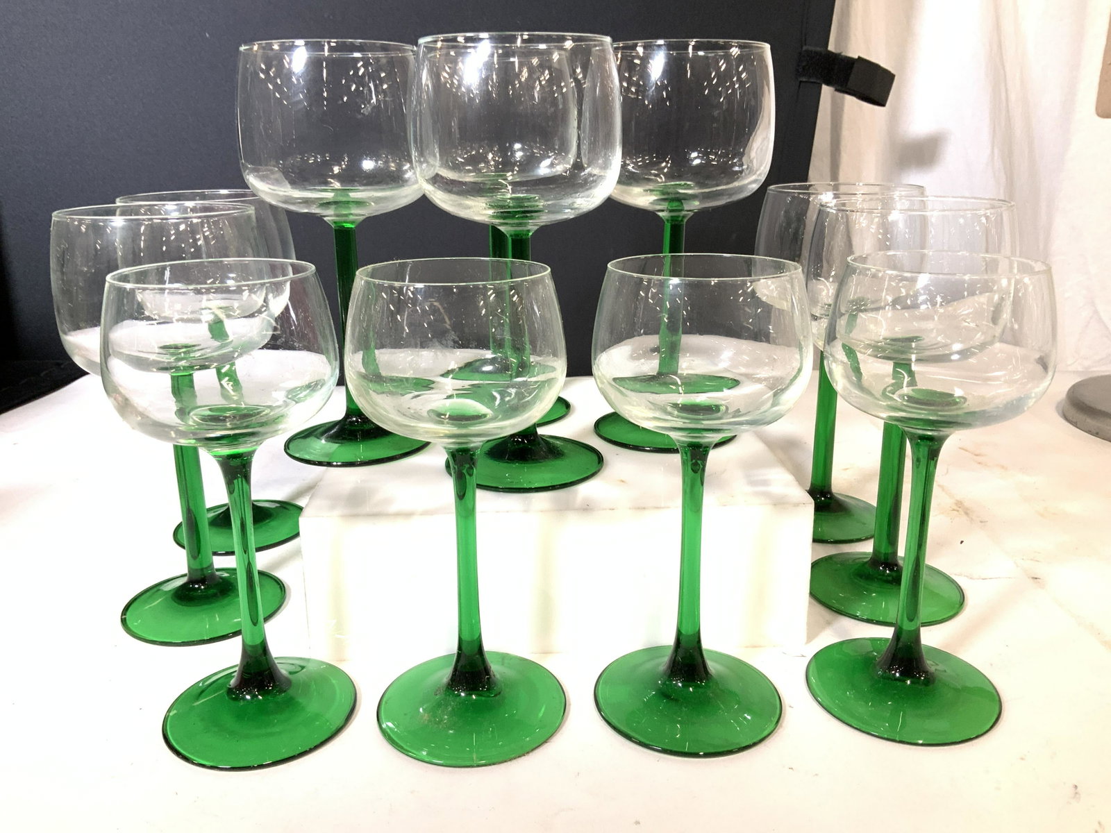 Vntg Green and Clear Glass Stemware Set 12: Green Glass Stem and Base, clear Glass Goblets. Various Sized for Wines and other liquors. Tallest measures 6.75 in. 3.5 in wide. Smaller measures 6.25 in. Ht , 2.75 in. W very nice vintage set with c