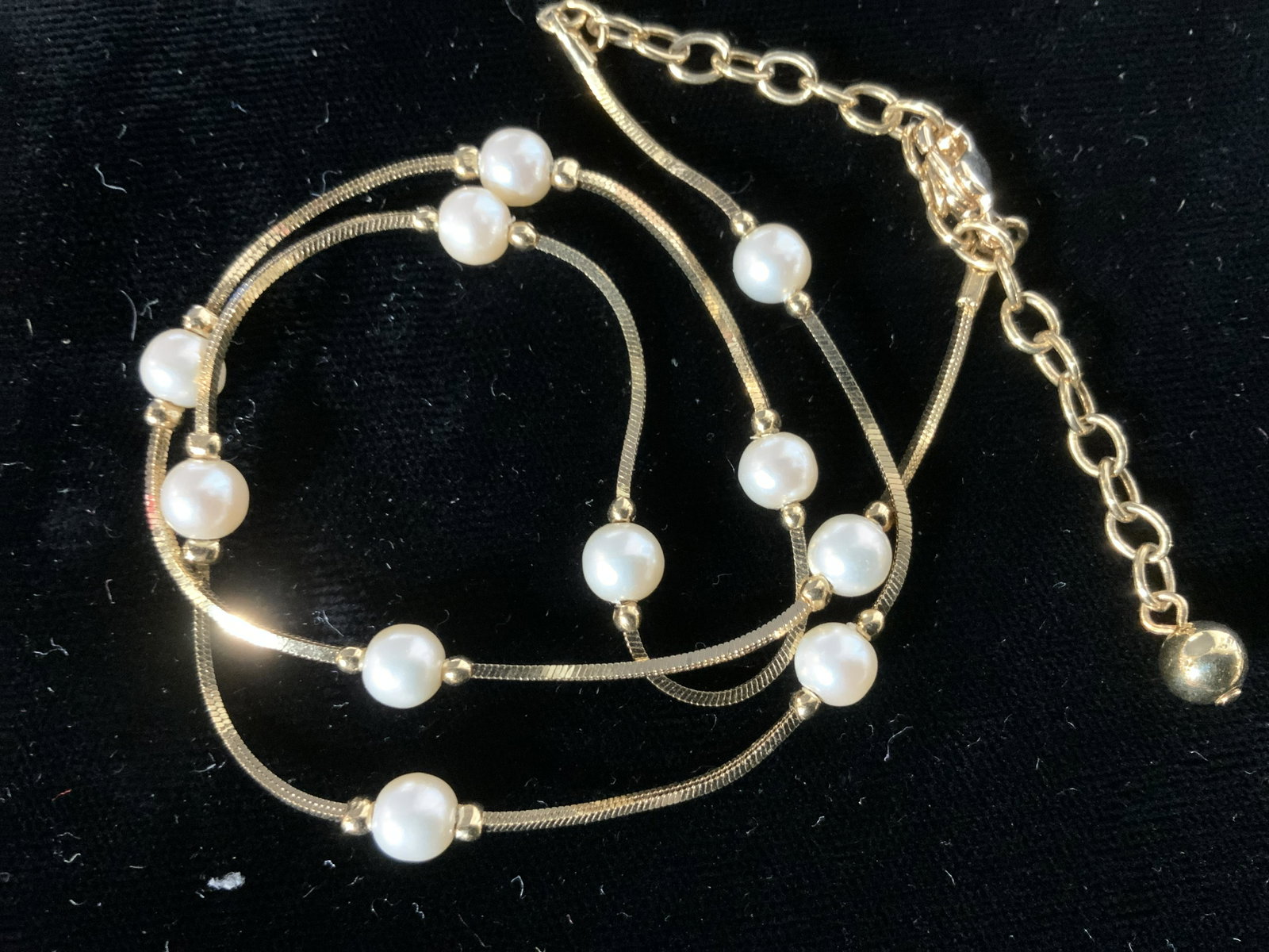 Gold Tone Bracelet & Faux Pearl Chain Necklace: Open work chain bracelet with box clasp, 6.75 in. Long, 1/2 wide. Adjustable Gold tone wheat chain necklace with faux pearls separated every in. 16.5 in. Longest length. Costume Jewelry, Cocktail Jewe