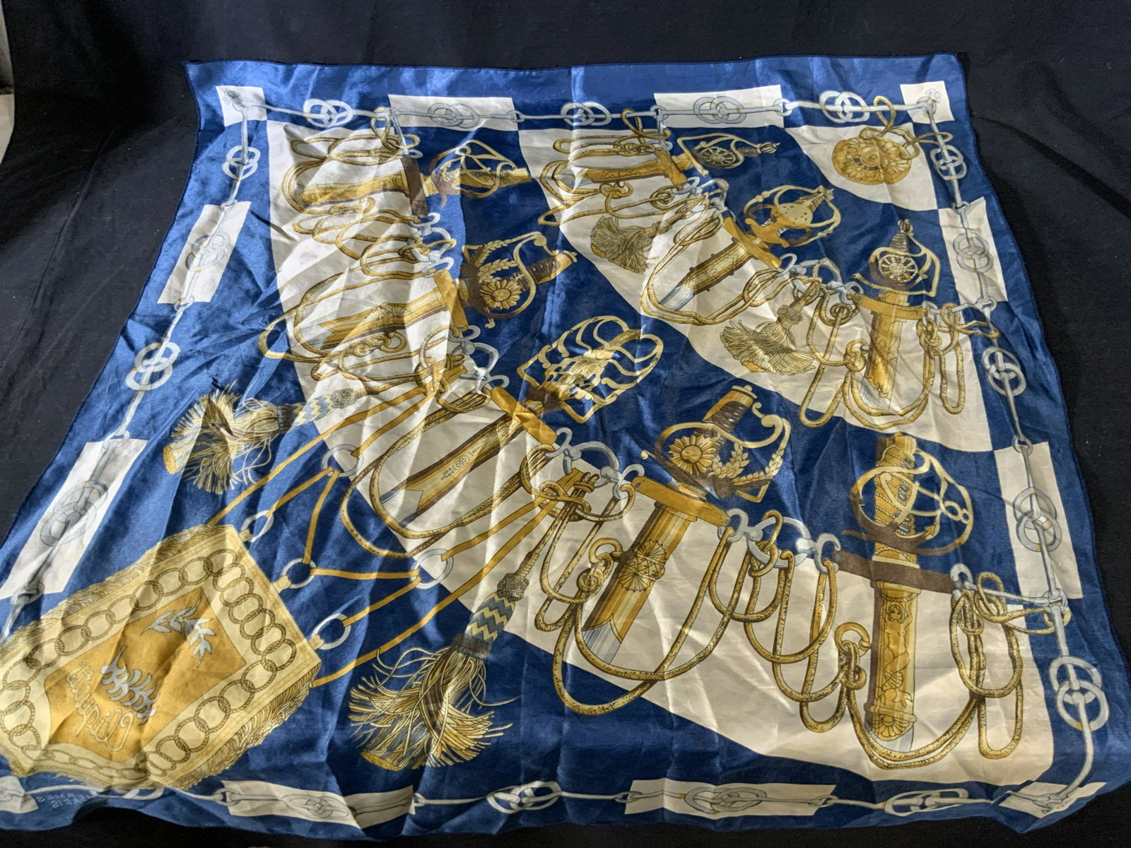 Cliquetis Women’s Scarf: Cliquetis Women’s Scarf, inscriptions read ‘Hermès Paris’ and ‘Cliquetis’, no apparent labels, a brightly patterned scarf with swords and interlocking chains, measures 32 7/8 x 34 1/2 inche