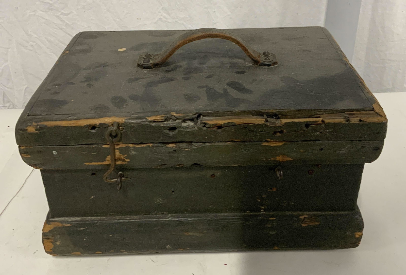 Antique Green Wooden Box: Antique Green Wooden Box, measures approximately 8 7/8 inches at tallest point x 14 inches at widest point, wear to piece and chipping of wood and paint consistent with age and use, hook to front has 