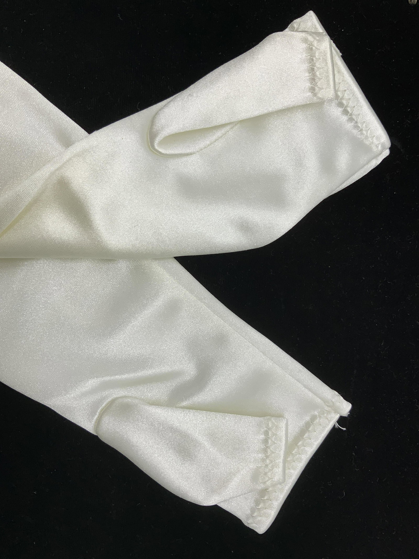 Off White Sateen Arm Sleeves: Arm sleeves with thumb hole/ finger sleeve, perfect for bridal wear. Measures 16 in. Long, tapered wrist, new never used. Has Stretch. Ladies Accessories, Bridal Accessory, Sateen Arm sleeve, ladies F