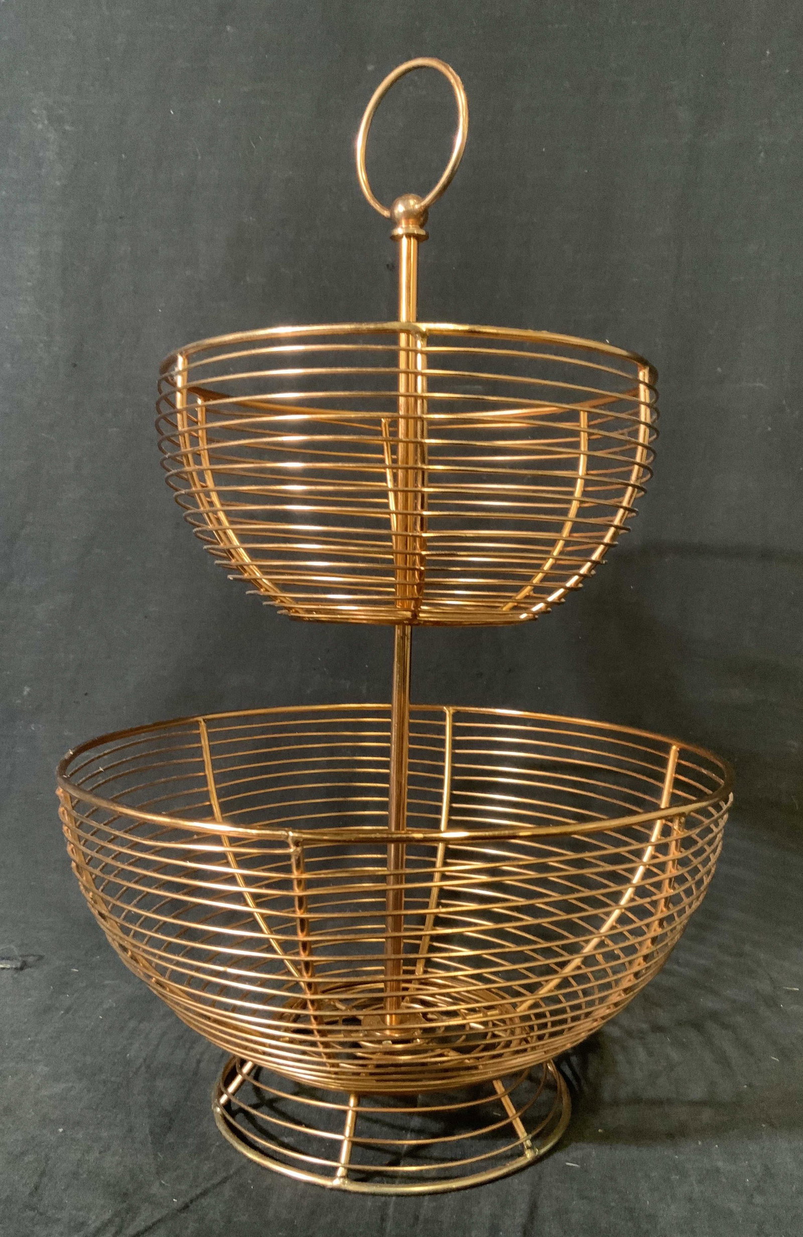 Copper Wired Two Tiered Fruit Basket: Copper Wired Two Tiered Fruit Basket, no apparent inscriptions or labels, measures 17 1/2 inches tall x 11 inches diameter at widest point, surface wear to piece, Copper wire two tiered fruit basket, 