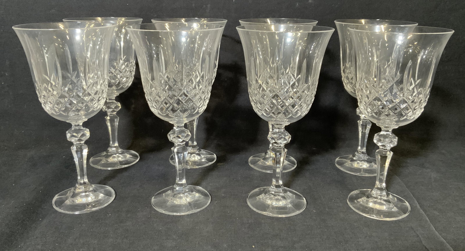 Set 8 CRYSTAL GUILD Cut Crystal Glasses: Set 8 CRYSTAL GUILD Cut Crystal Glasses, label reads ‘Crystal Guild 24% lead crystal Czechoslovakia’, all measure 7 1/2 inches tall x 3 3/4 inches at widest point, surface wear to glasses, Crystal