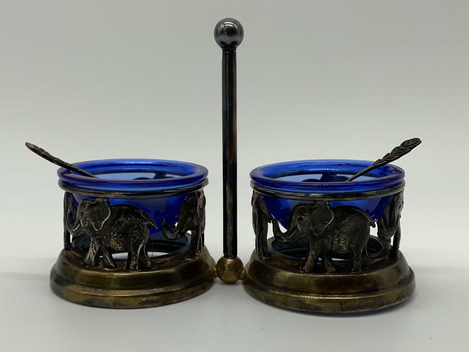 Sterling Silver & Glass Salt Cellar: Sterling Silver & Glass Salt Cellar, inscription to base reads ‘925’, measures 3 1/2 inches tall x 5 inches wide, weight of elephant stand: 3.44 ozt, surface and tarnishing to piece, Sterling silv