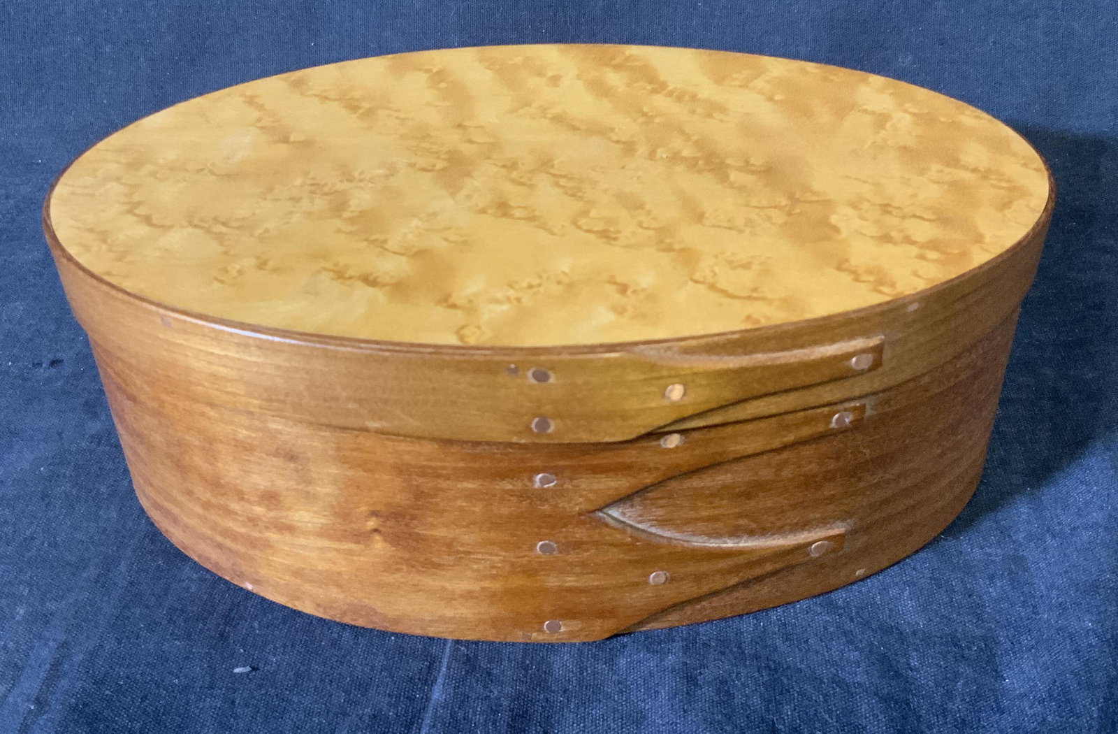 D.H. OSMER Cherry & Maple Oval Box: D.H. OSMER Cherry & Maple Oval Box, inscriptions to reverse read ‘D.H. Osmer 1995’, card inside describes box and types of wood, measures 2 5/8 inches tall x 7 1/4 inches at widest point, surface 