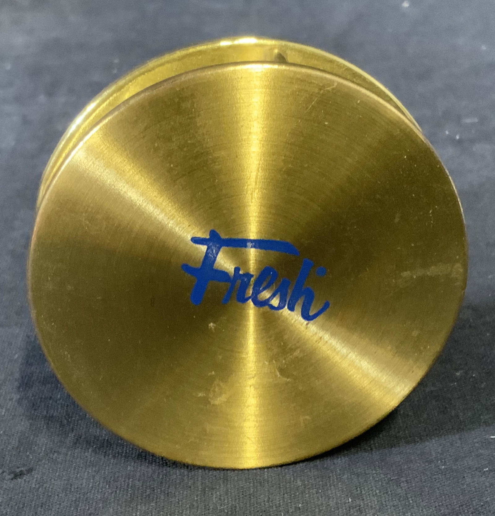 Brass Magnifying Glass FRESH, JAPAN: Brass magnifying glass. Reads as FRESH, JAPAN. Underside is lined with fabric. Measures approx 2.75 inches in diameter. Wear is consistent with age and use. Magnifying glass, reading glass, decorative