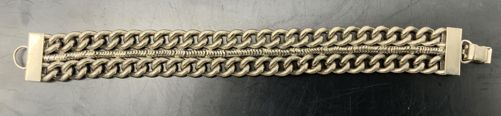 Curb Chain Bracelet: Curb Chain Bracelet with fold over clasp, no apparent inscriptions or marks, measures 7 3/4 inches long, surface wear to piece, Curb chain, chain bracelet, bracelet, jewelry, estate jewelry, womenÂ��