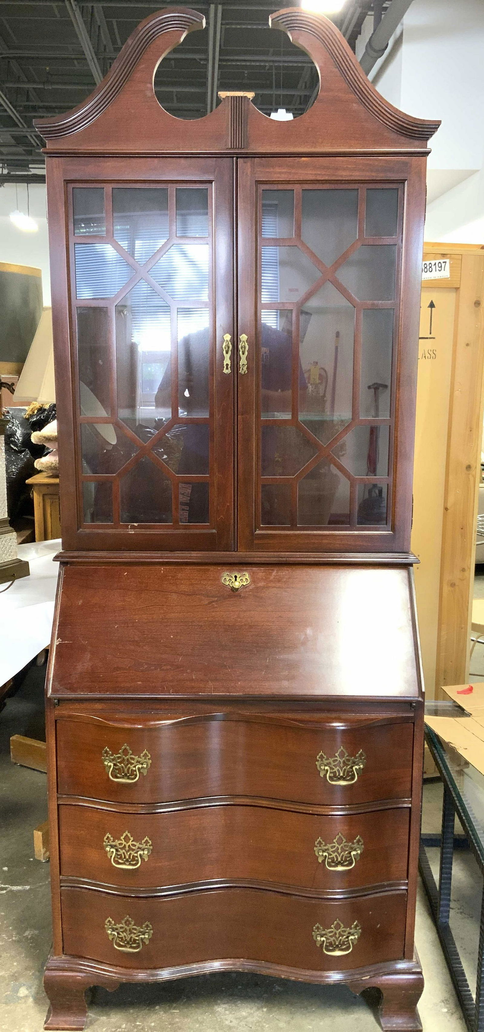 JASPER CABINET Vntg Carved Wooden Secretary: Interior of top drawer is marked JASPER CABINET. Piece is brown toned & wooden. Top half has windowed display cabinet with 2 glass shelves. Lower half of piece has flip open desk & 3 drawer each with
