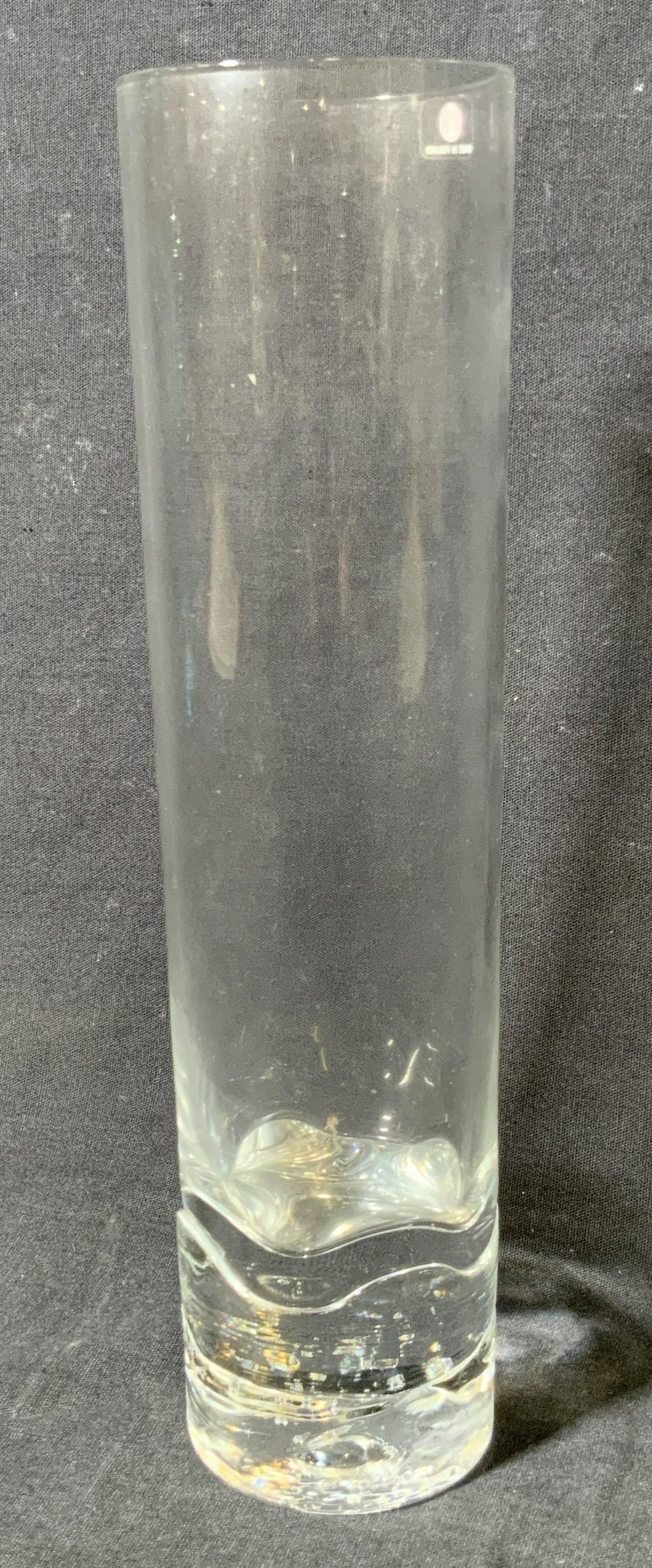 IITTALA Signed Finnish Crystal Vase: A clear crystal Iittala vase. Base has a unique design. Purposeful bubbles within the base. Weighty. Sticker to rim features Iittala trademark and reads Made in Finland. Some surface wear consistent w