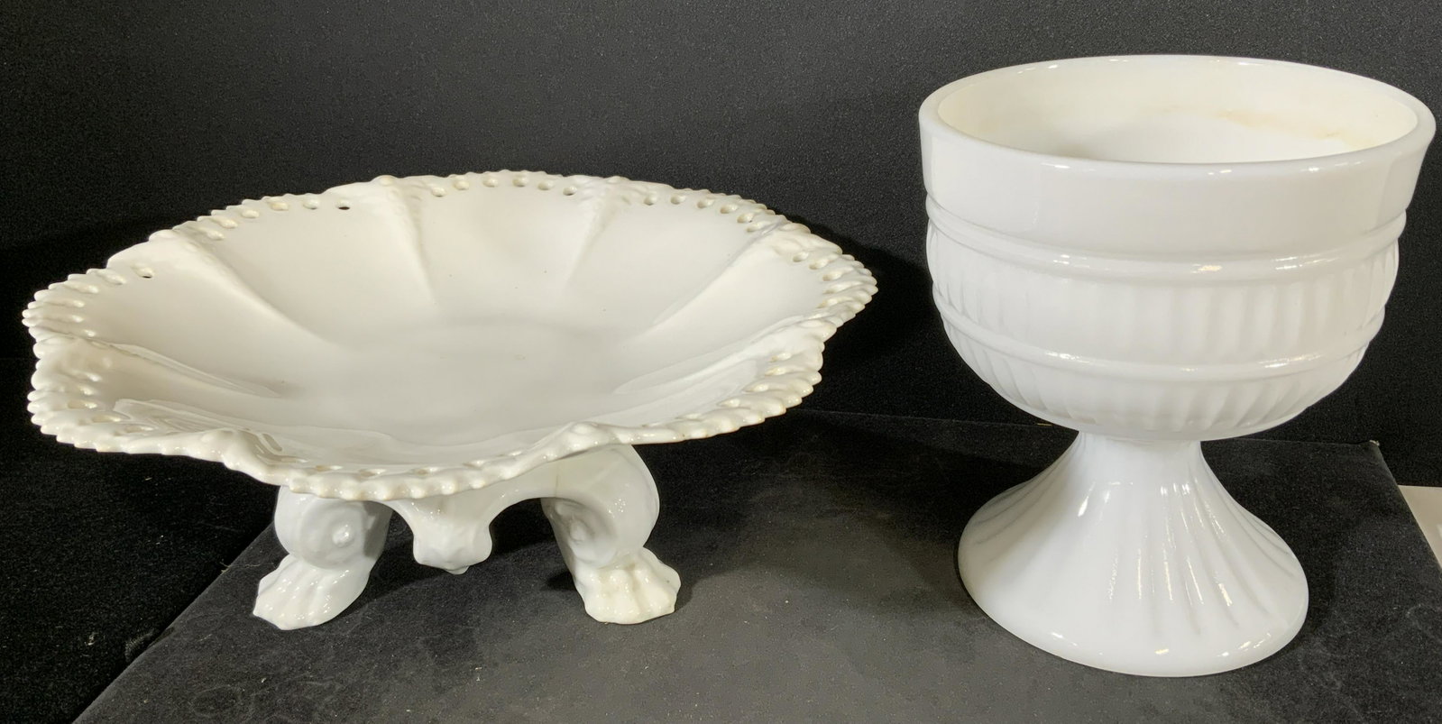 Lot 2 Milk Glass Accessories: Lot 2 Milk Glass Accessories. Goblet and footed dish. Surface wear to both including cracking and crazing. Goblet / chalice measures 5 1/2 in tall by 4 3/4 in in diameter. Plate measures 3 1/2 in tall