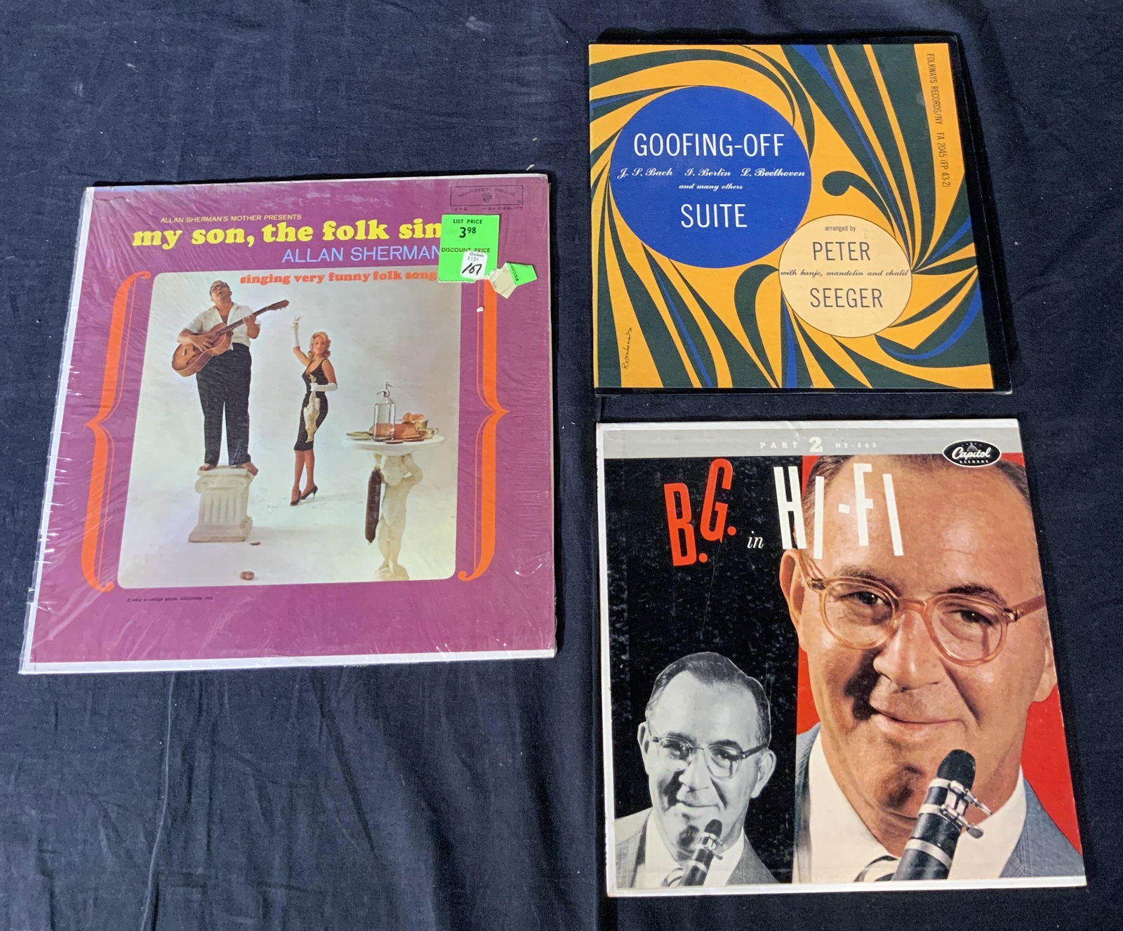 Lot 3 Folk Records & Goodman Orchestra Vinyls: Lot 3 Vintage Folk Records & Goodman Orchestra Vinyl Records, titles reads ‘B.G. in HI-FI’, ‘Goofing-Off Suite’, & ‘My Son the folk Singer’, largest item measures 12 1/4 inches in width an