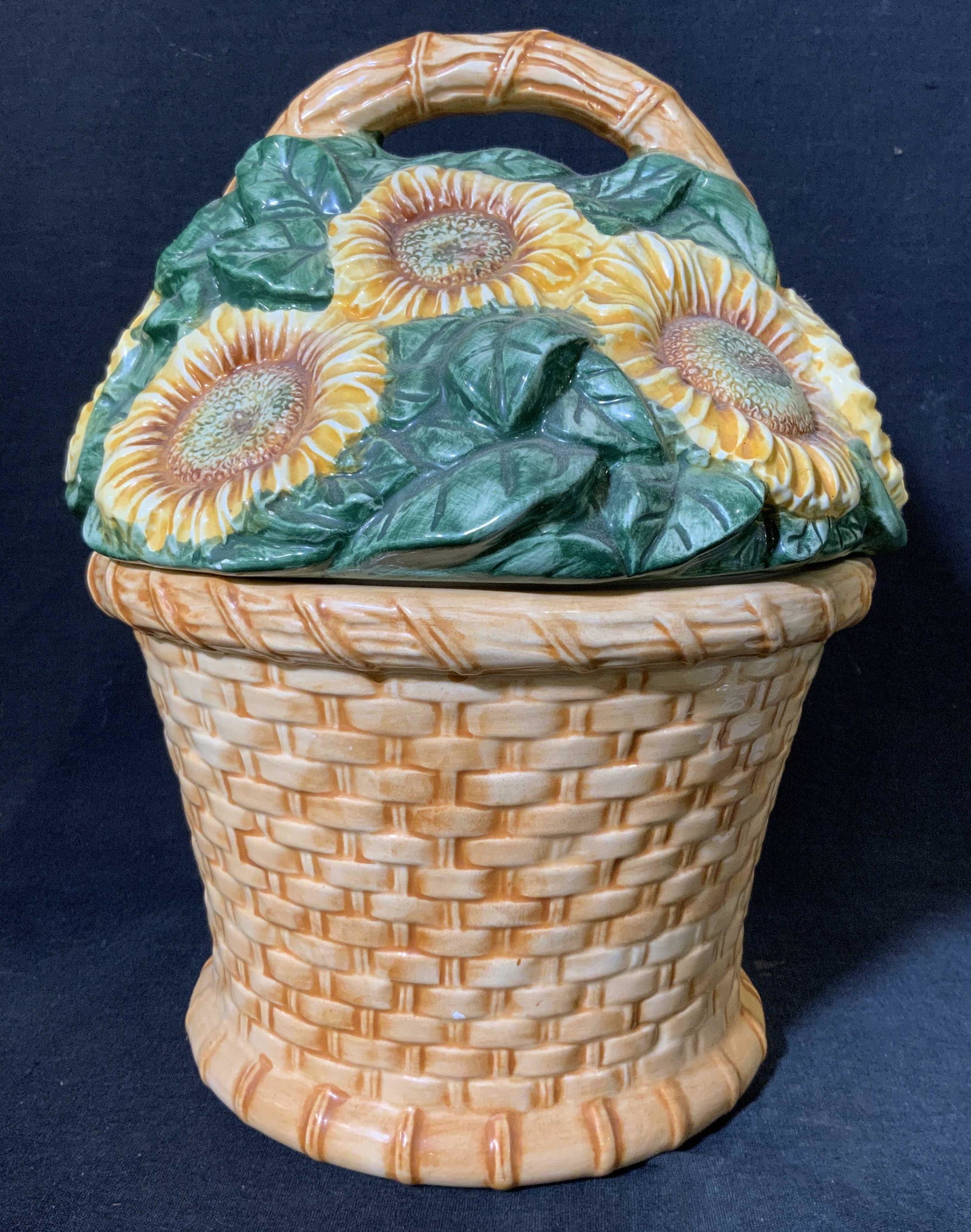 COOKS CLUB Sunflower Basket Cookie Jar: COOKS CLUB Sunflower Basket Cookie Jar, inscriptions read ‘Cooks Club Quality & Design’, measures 10 3/4 inches tall x 9 inches wide, surface wear, some chips, and losses to glaze Cooks club, sunf