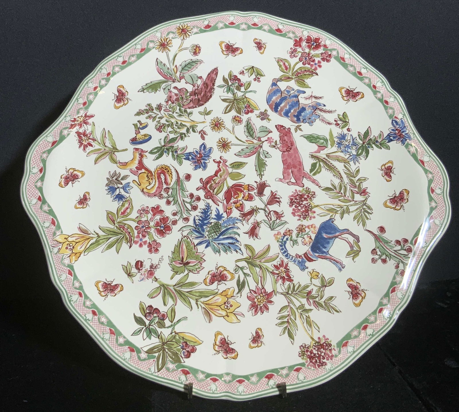 GIEN FRANCE Signed Hand Painted Porcelain Platter: A white porcelain platter decorated with hand painted a tire motifs. Animals, florals, insects, and foliage depicted all along the obverse. Patterned trim. Underside signed Gien France, Jardin Imagina