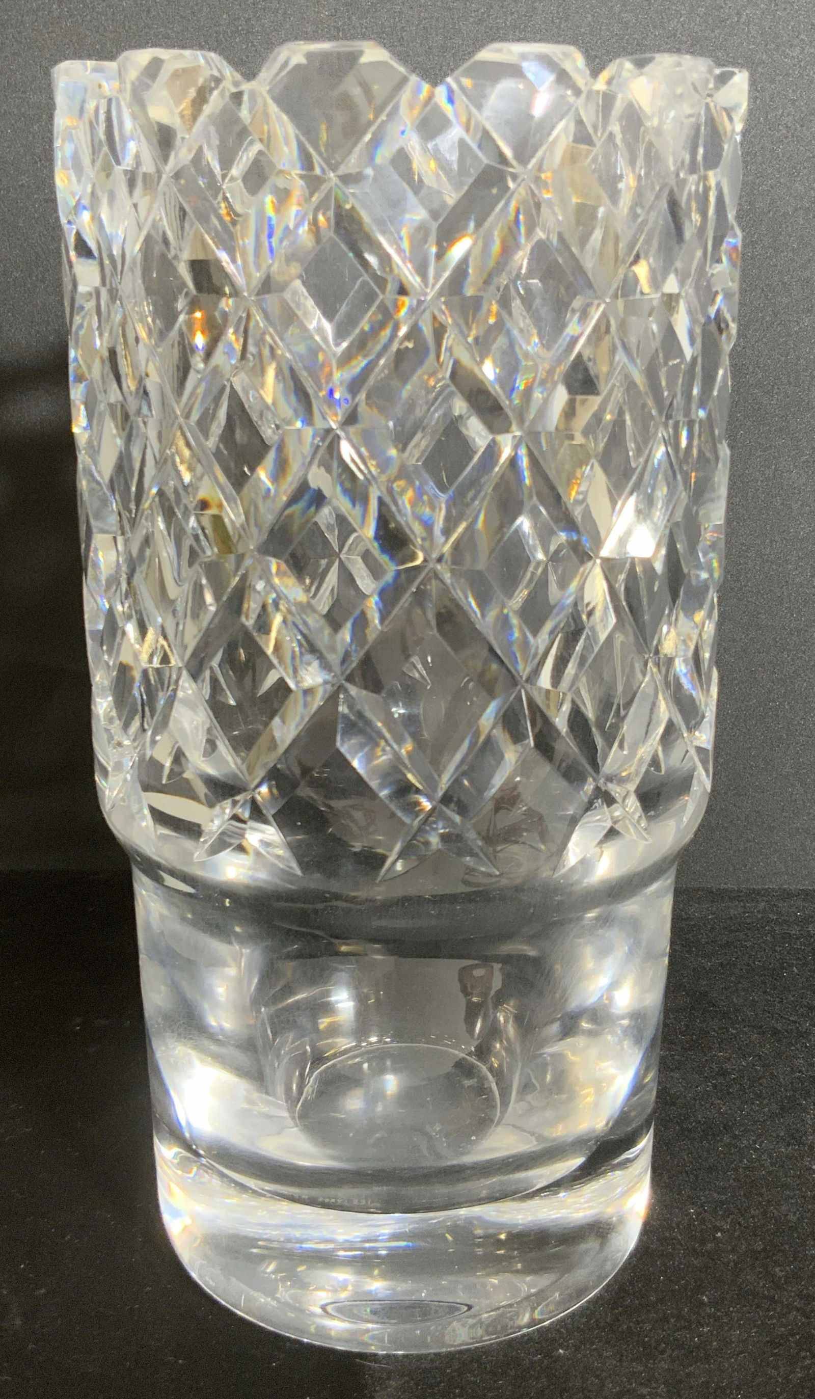 Vintage ORREFORS Signed Cut Crystal Table Vase: A vintage clear cut crystal table vase. Saw tooth style rim. Thick walled and weighty. Underside is signed Orrefors. Some chips to rim. Some surface scratches. Approx. 10H x 5W in. Vintage Orrefors, O
