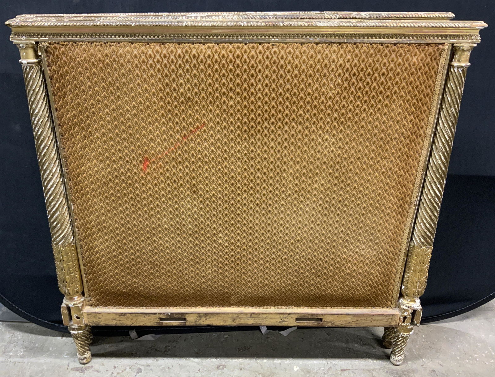 Pair Antique Twin Headboards: Pair of antique headboards, upholstered with brawn, velvet like fabric. Each is hand painted, decorated with carved detailing. Detailing resembles flower petals, and leaves, columns decorated with spi