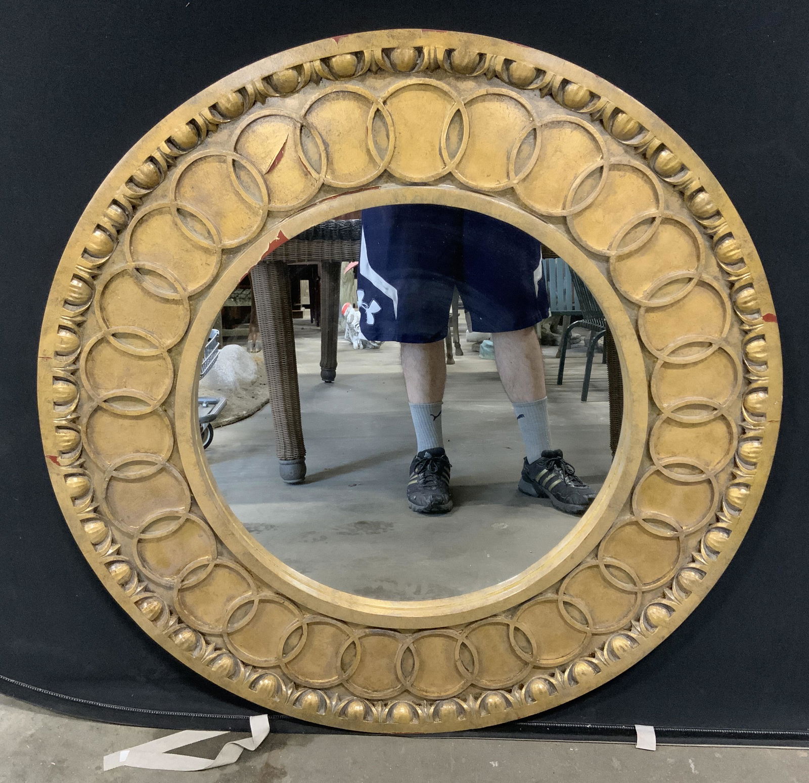 MCLAIN WIESAND Gold Mirror w Circular Design: MCLlain Wiesand wall mounted mirror. Mirror surrounded by a series of interlocking circles. Label on back reads as MCLAIN WIESAND. Colored with gilt paint, paint chipping present. Wear is consistent w