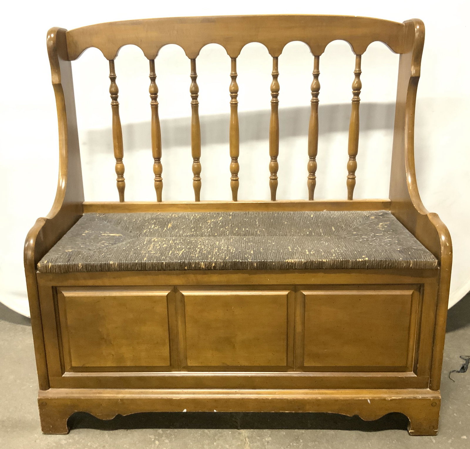 Vintage Wooden Bench Chest W Rattan Lid: Bench is vintage and wooden. Piece has rattan seat lid. Bench is possibly antique. Piece has carved wooden backrest. Piece measures approximately 39 inches tall 38 inches long 18 inches deep. Vintage 