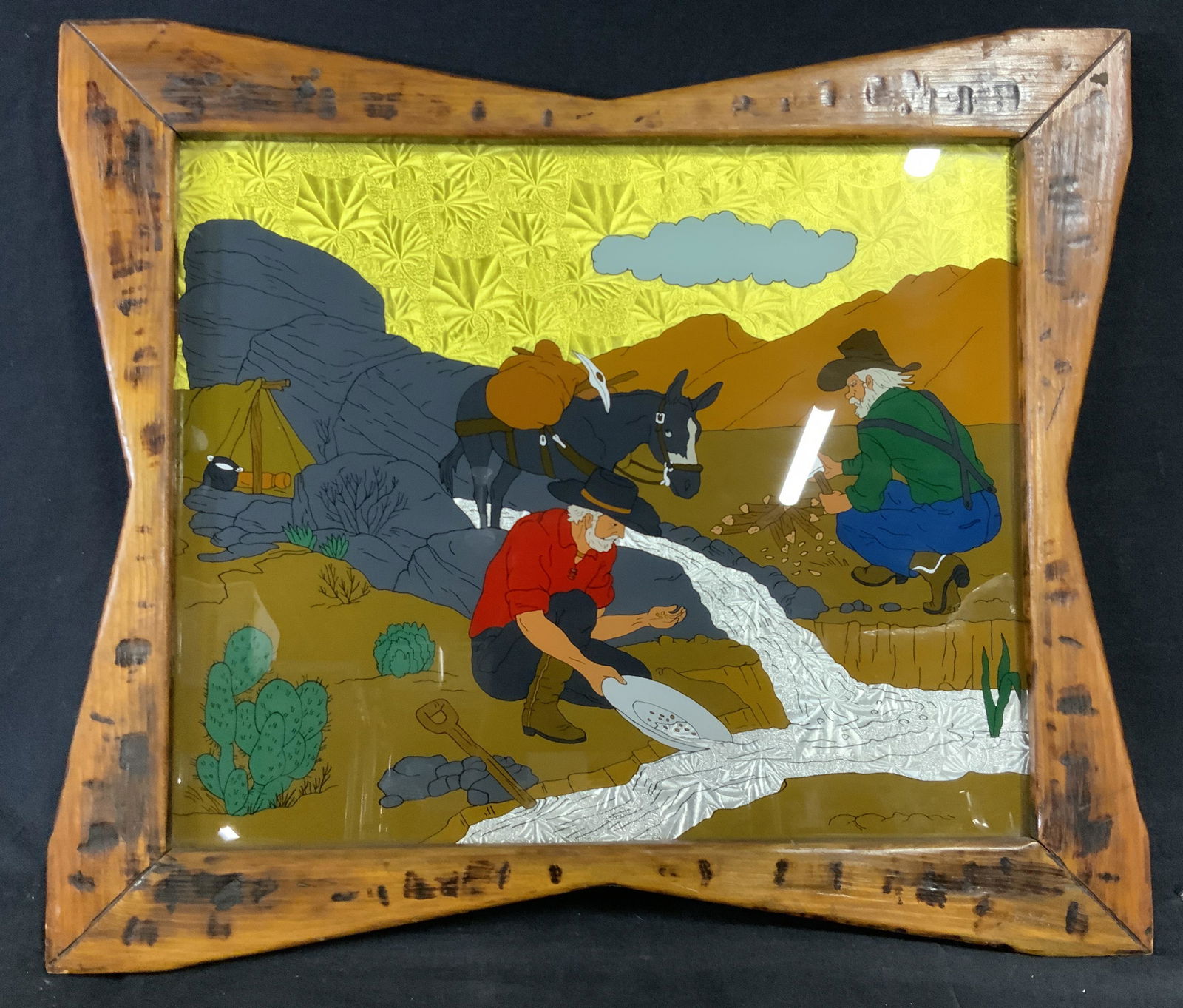 Gold Panning Scene Mixed Media Artwork: Gold Panning Scene Mixed Media Artwork, no apparent inscriptions or markings to piece, subject a scene of two men who look to have been camping and are gold panning and cutting up wood in the desert,