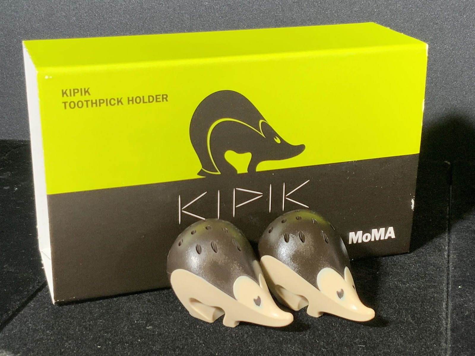 KIPIK Porcupine Toothpick Holders, Original Box: A pair of composite toothpick holders crafted to resemble porcupines. Contained in their original packaging which reads Kipik, MOMA. Pieces and packaging have some wear. Box measures approx 2.5H x 7W
