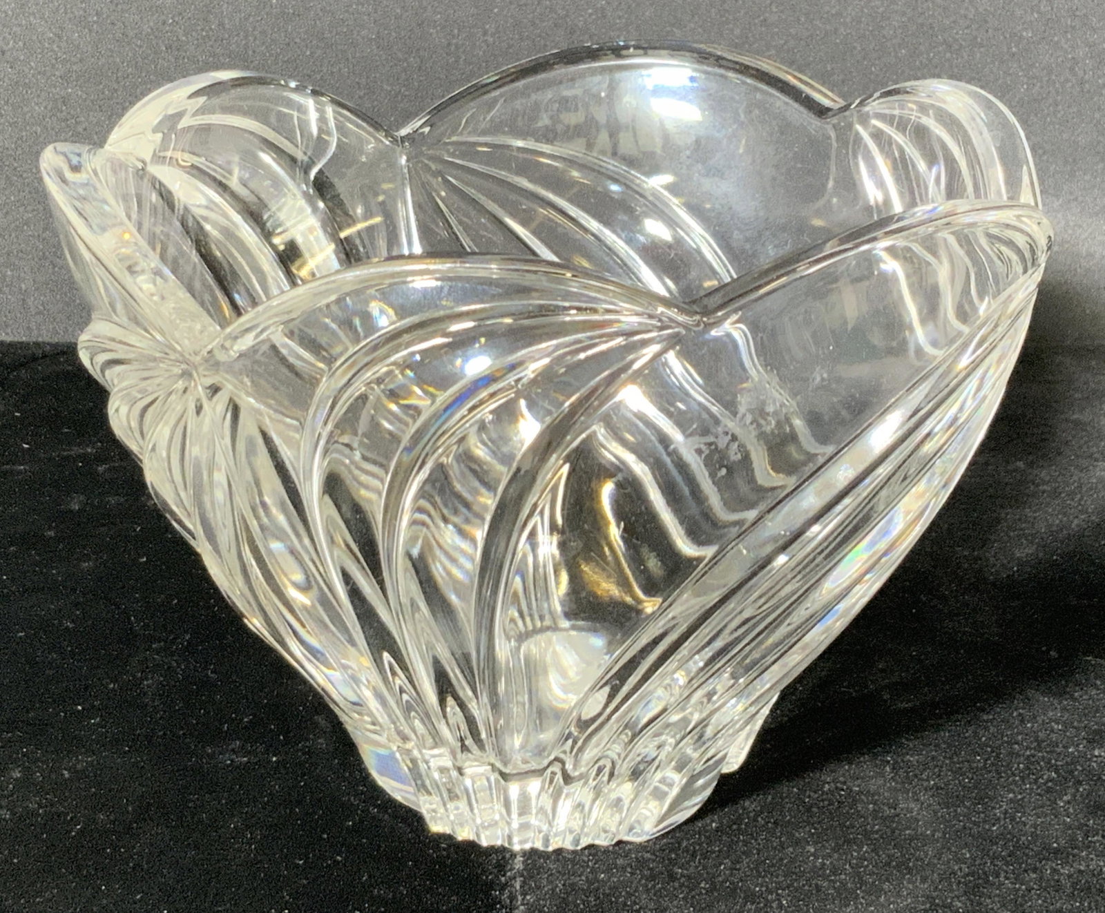 LENOX Signed Ribbed Crystal Scalloped Rim Bowl: A ribbed clear crystal scalloped rim bowl. Ribs have a curved pattern. Underside of the piece signed Lenox. Measures approx 4H x 5.5W in. Some surface wear consistent with use. Lenox Crystal, Lenox ho