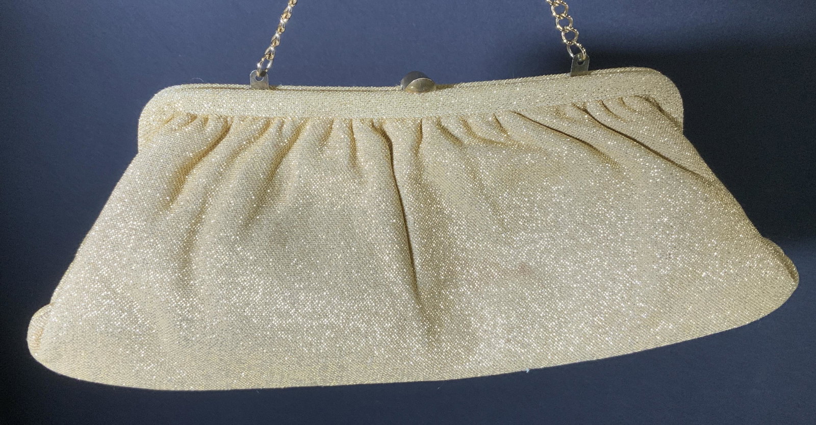 Vintage Gold Metallic Nylon Clutch & Gloves, 3: Vintage Clutch/ handbag with matching glove, ca 1974. Gloves are made of stretch nylon and metallic thread, measures 11 in L to mid lower arm and fits size Medium. Clutch has tuck in gold toned chain,
