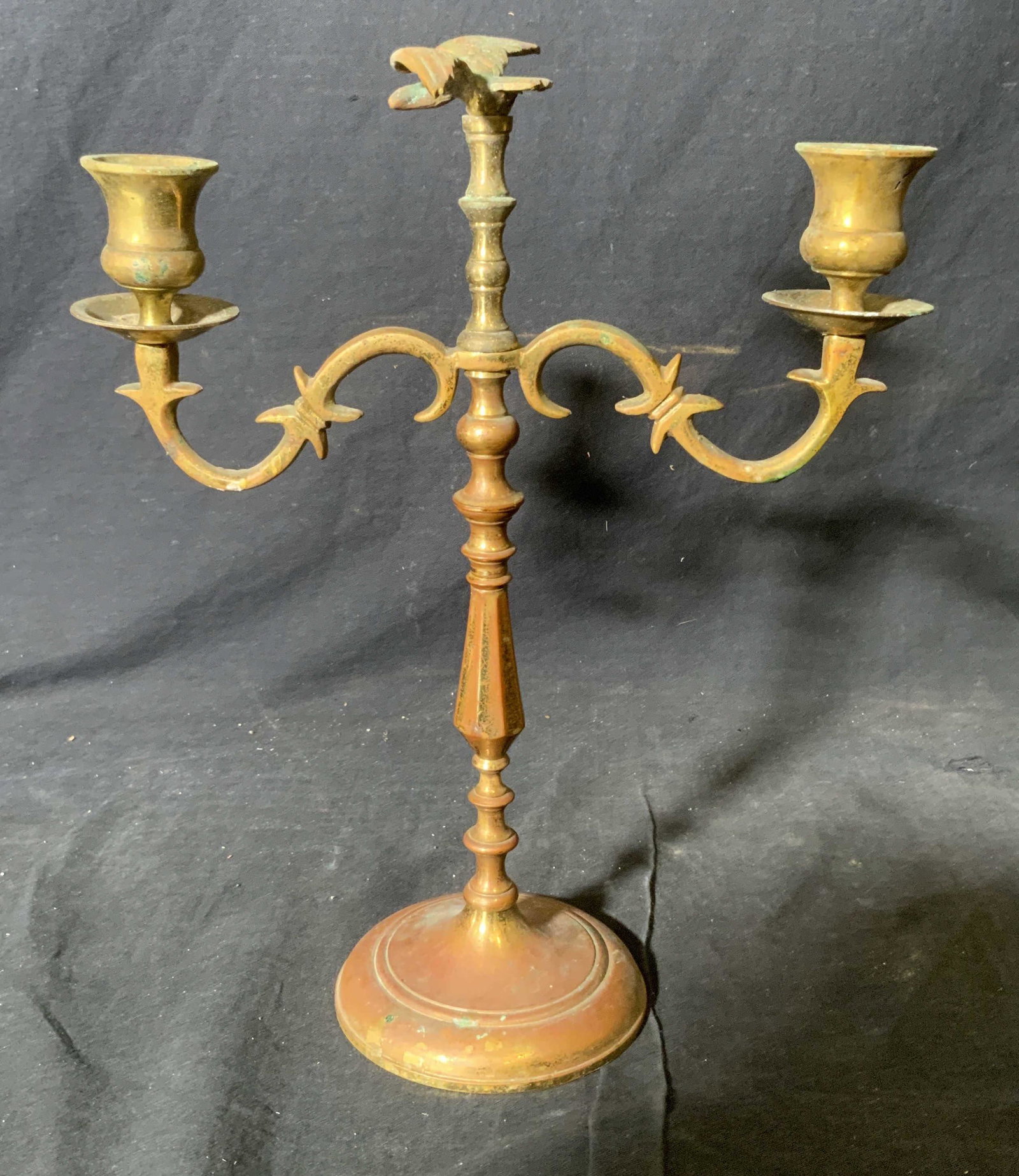 Brass Plated Candelabra: Brass Plated Candelabra, no apparent inscriptions or markings, possibly brass plated possibly brass, subject a candelabra with two ares and a finial in the shape of a bird, heavily rusted and oxidized
