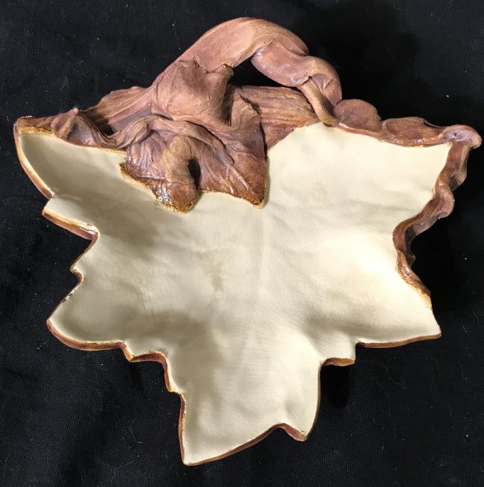 Signed Hand Formed Earthenware Trinket Dish: Signed Hand Formed Earthenware Trinket Dish In the shape of a leaf with cream toned glaze, signed illegibly on underside 1992, some crazing to piece, measures approximately 7 inches wide x 6.5 inches