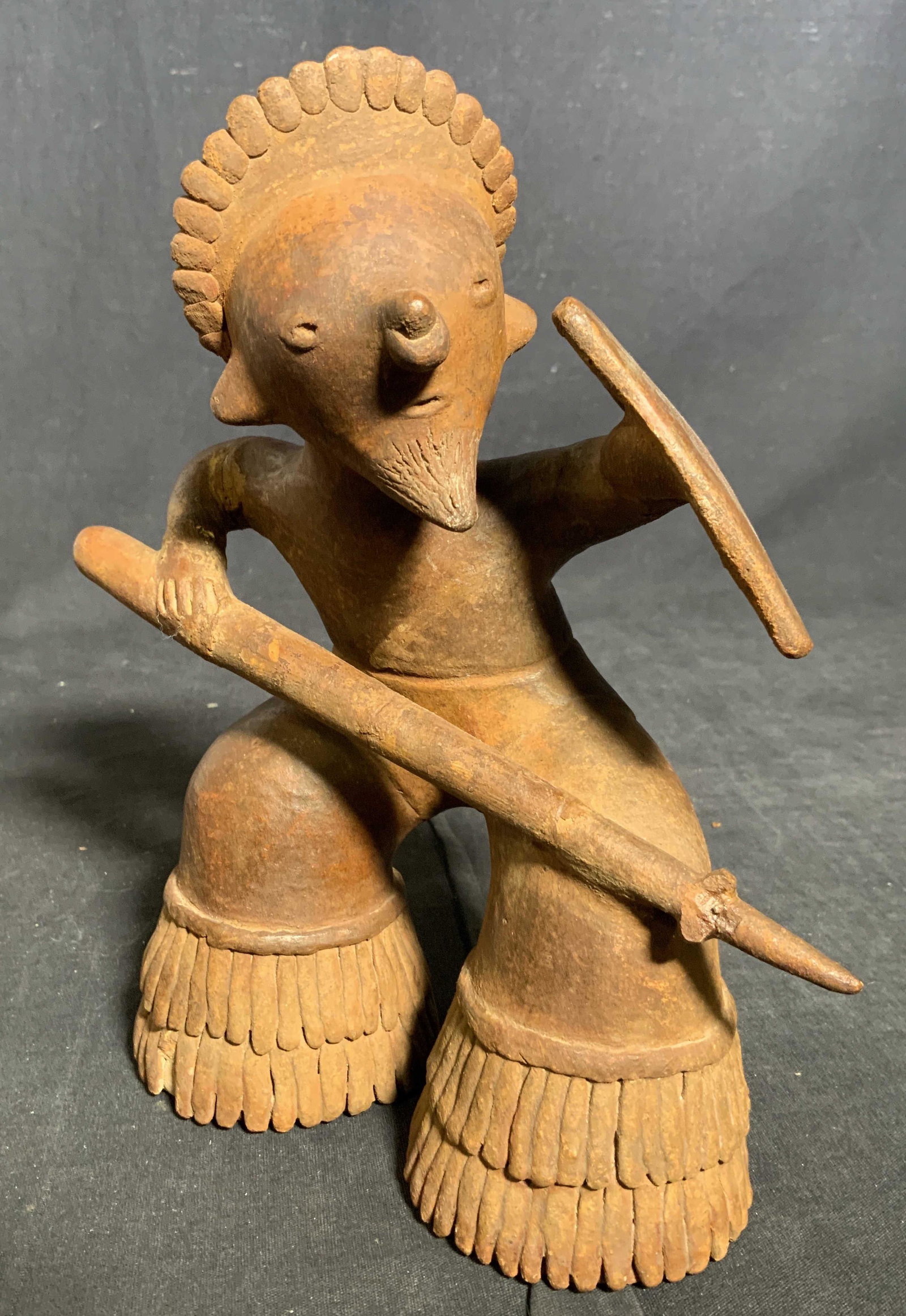 Vintage Metal Folk Art Figural: Vintage, possibly antique, metal figural. Depicts a figure wielding a spear and shield. Appears to be hand made. Wear is consistent with age and exposure, some loss present. Measures approx 9 inches h
